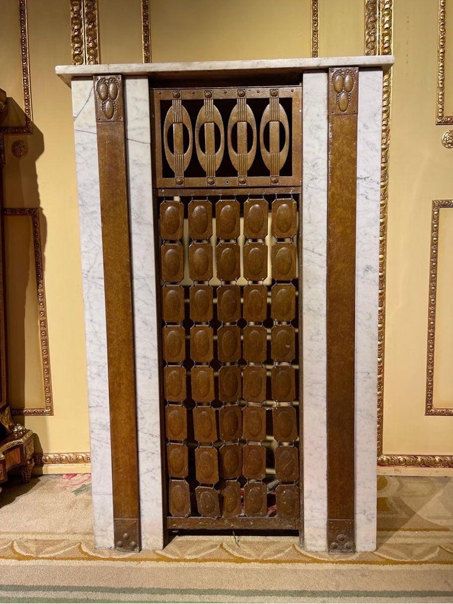 Unique art nouveau heater cladding / fireplace cladding.

Impressive and antique Art Nouveau fireplace / heating panel. White marble with gray mottled structure.
Original Art Nouveau brass applications.
Very impressive and beautiful.