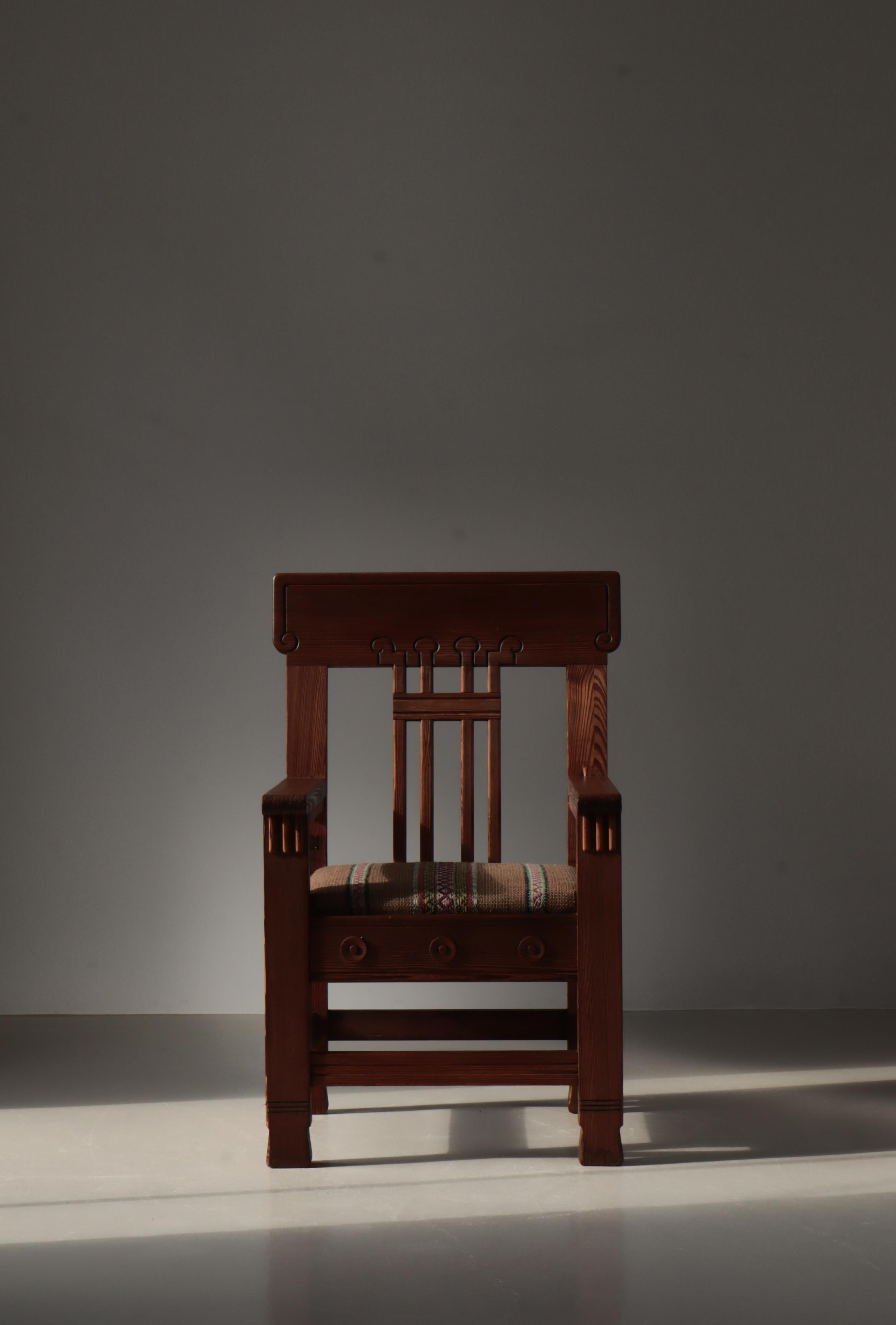 Monumental and important pinewood artist´s chair by Danish sculptor Siegfried Wagner. Made in the 1910s by Wagner and fellow artist and trained cabinetmaker Jens Peter Dahl-Jensen. The large armchair is richly decorated in Art Nouveau style.