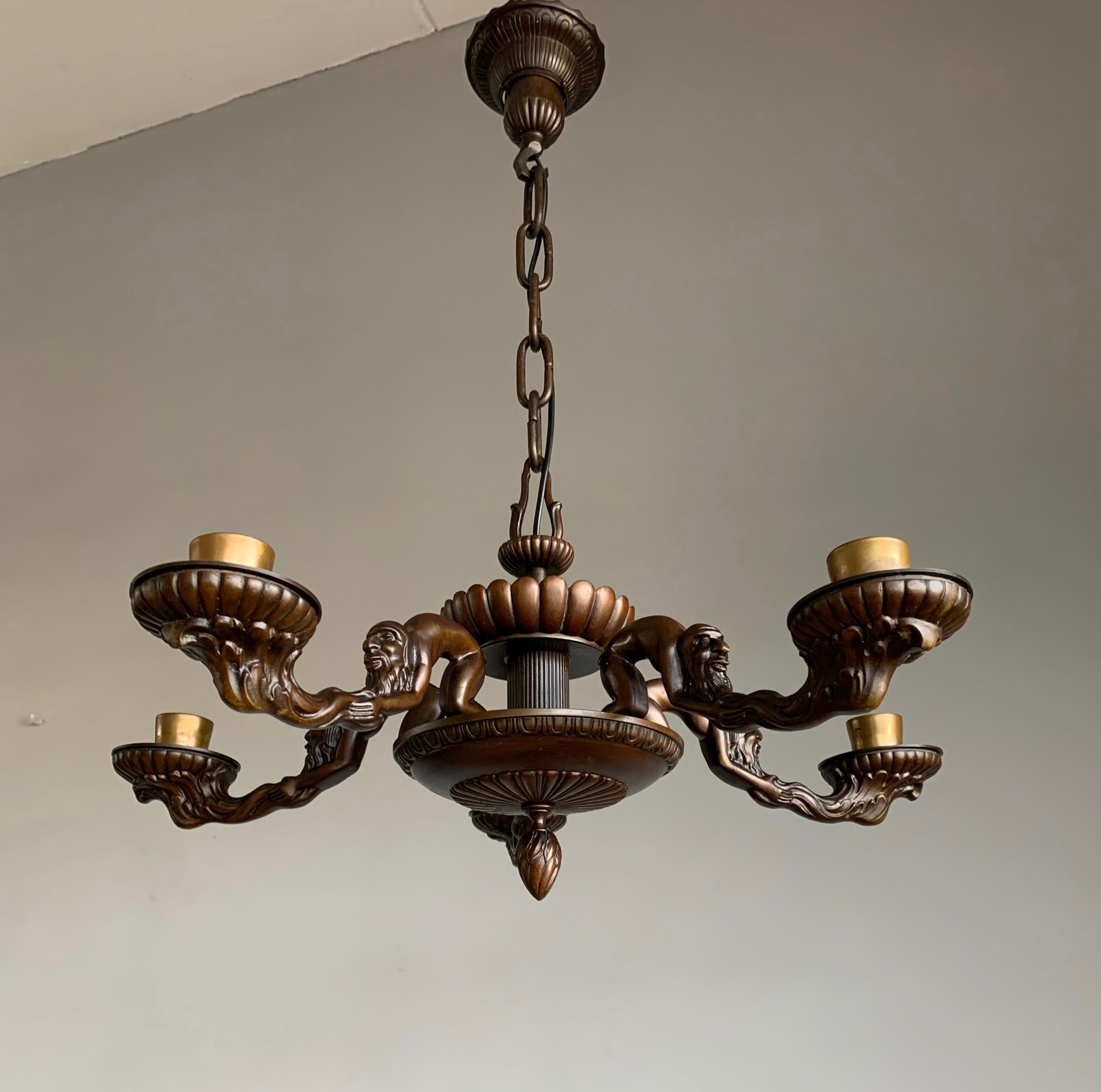 One of a kind antique chandelier with amazing arms and natural mineral stone shades.

With early 20th century lighting as one of our specialities we were amazed when we found this unique light fixture. We were amazed by the quality and beauty and to
