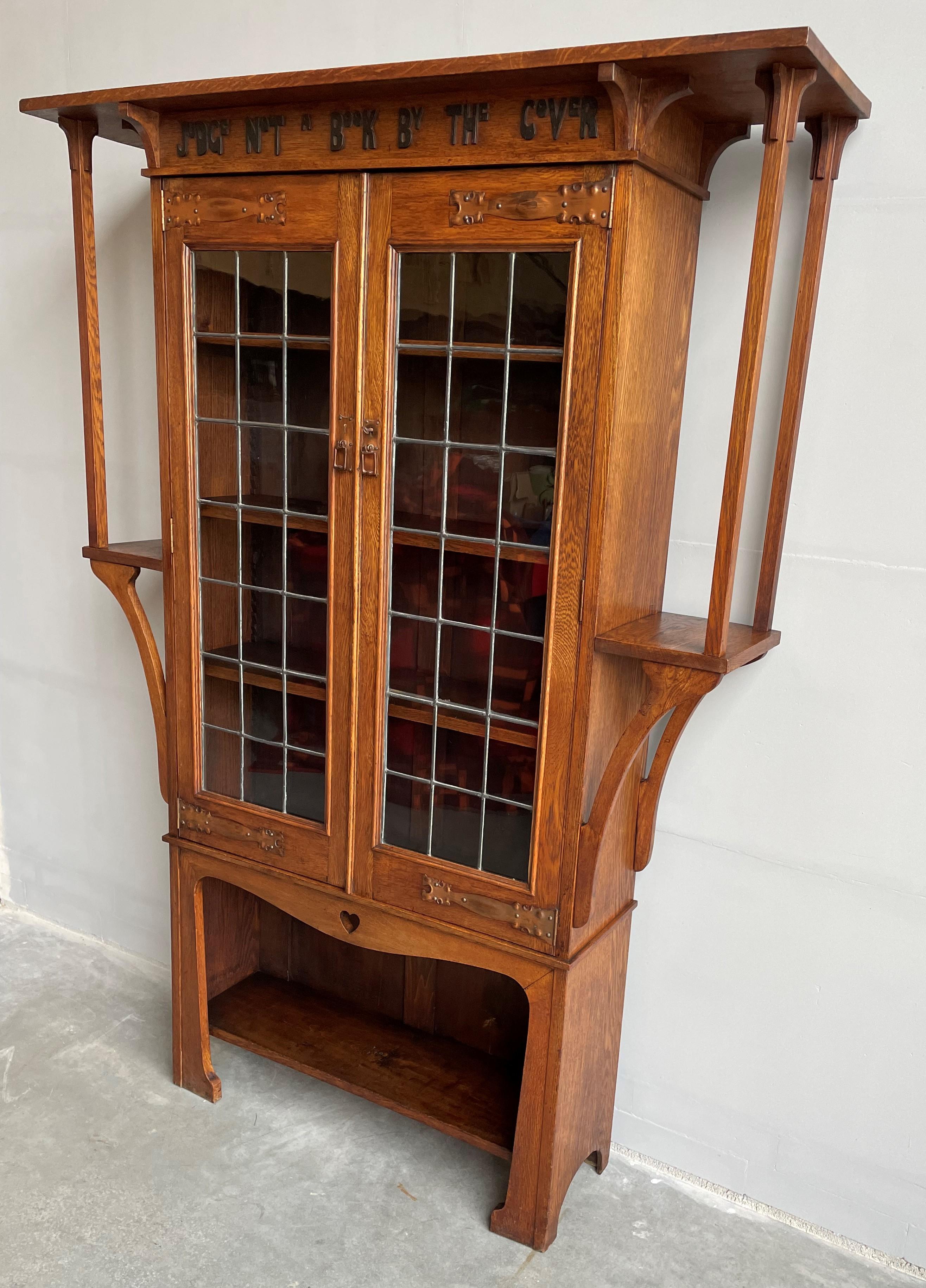 Pure Arts and Crafts bookcase reminding us to 'Judge Not A Book By The Cover'.

This early and good size Arts & Crafts bookcase with its stunning design makes a great statement piece for your private library or living room. In our view this is not