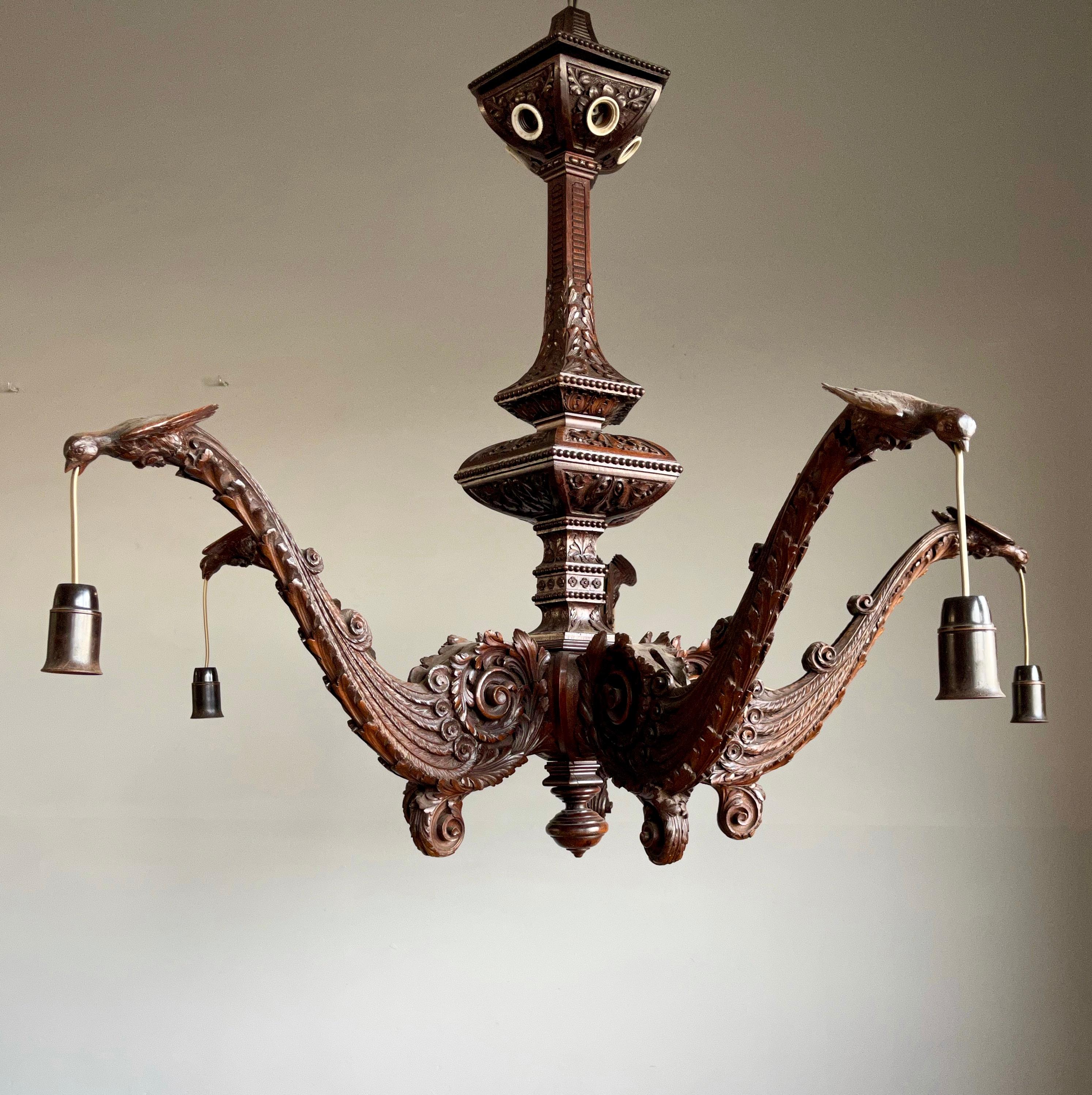This impressive large and all hand carved wooden pendant light, is a true work of art. It displays the finest quality carving and the skills of its maker. 

It really is incredible how this master carver has managed to carve perfect and very deep