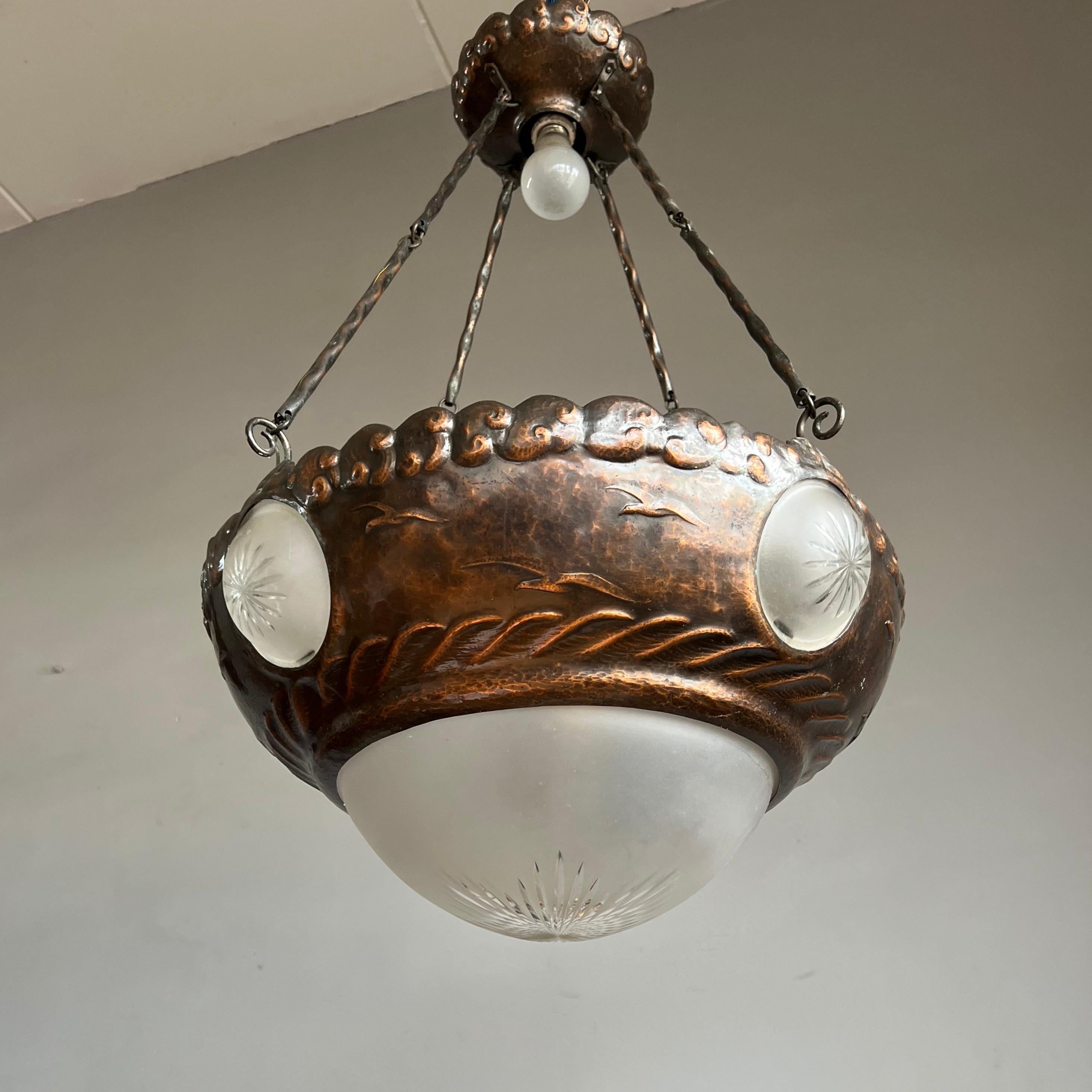 Stunning, sizeable and highly decorative Arts & Crafts light fixture.

This gorgeous, six-light chandelier is another one of our recent great finds. Inspired by the beauty of nature and wildlife, Arts & Crafts designers and craftsman around the
