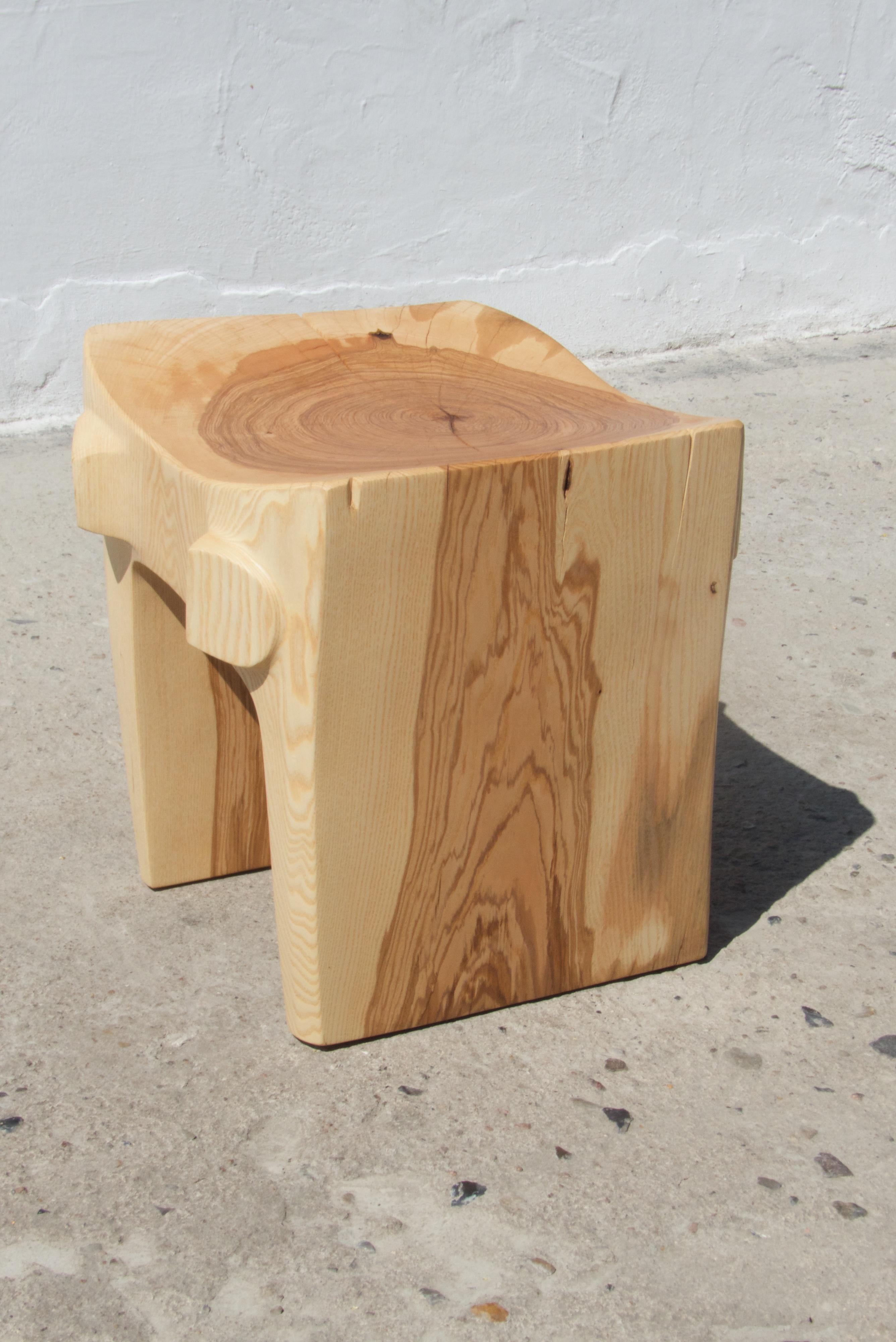 Unique signed Ash stool by Jörg Pietschmann
Ash
Dimensions: H 55 x W 97 x D 53 cm


Side piece of an old oak with exceptional burl on colorful legs. Polished oil finish.

In Pietschmann’s sculptures, trees that for centuries were part of a