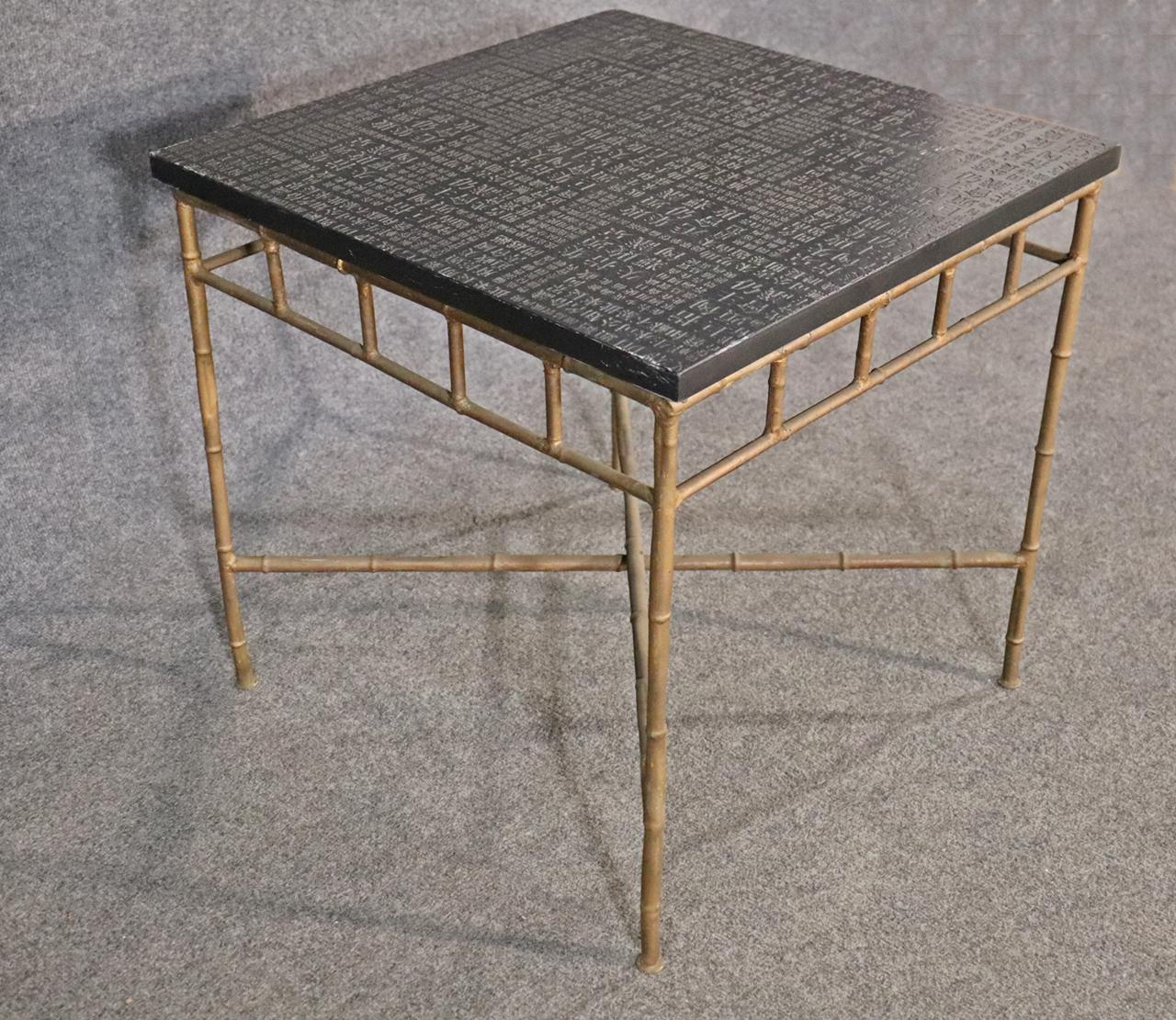 Slate or possible stone Asian character top.  Faux bamboo metal base. 20 1/4