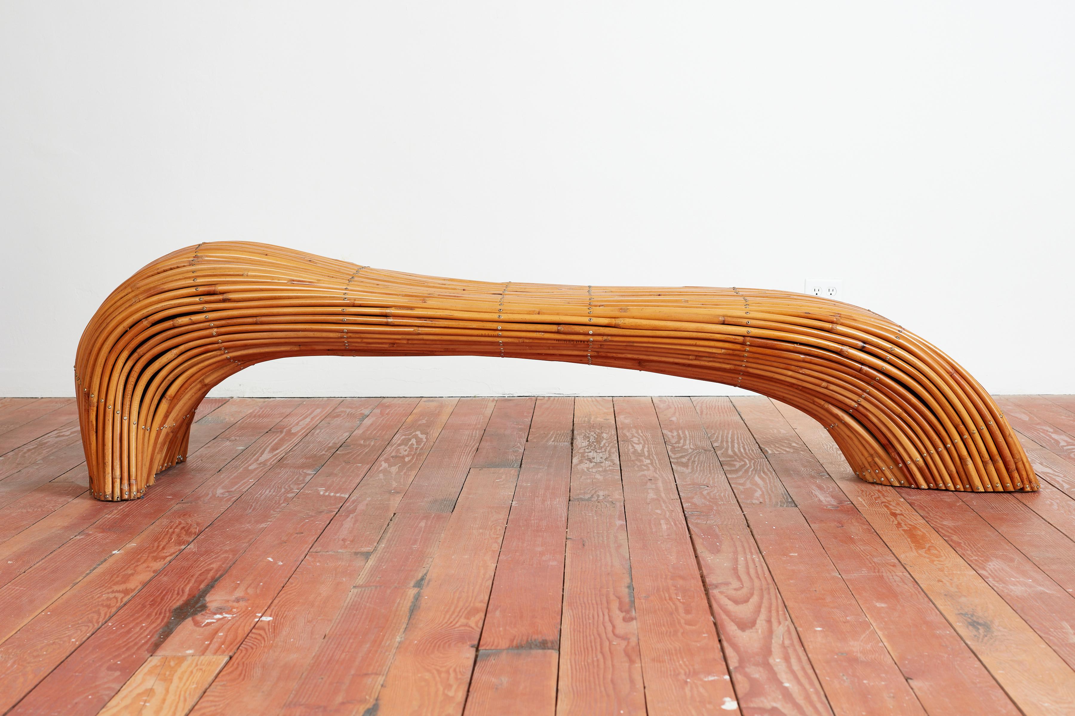 Unique large scaled bench in bamboo with undulated irregular shape. 
Artistically hand made covering a solid wood bench with hand hammered nails 
Piece of art and sculpture combined ! 
1970s.