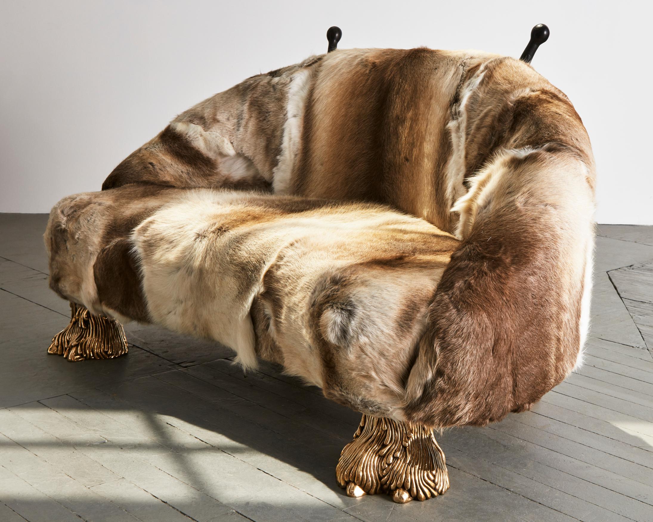 Unique Beast settee with Finnish Reindeer fur, carved wooden horns and cast bronze camel toe feet. Designed and made by The Haas Brothers, USA, 2013. 
 