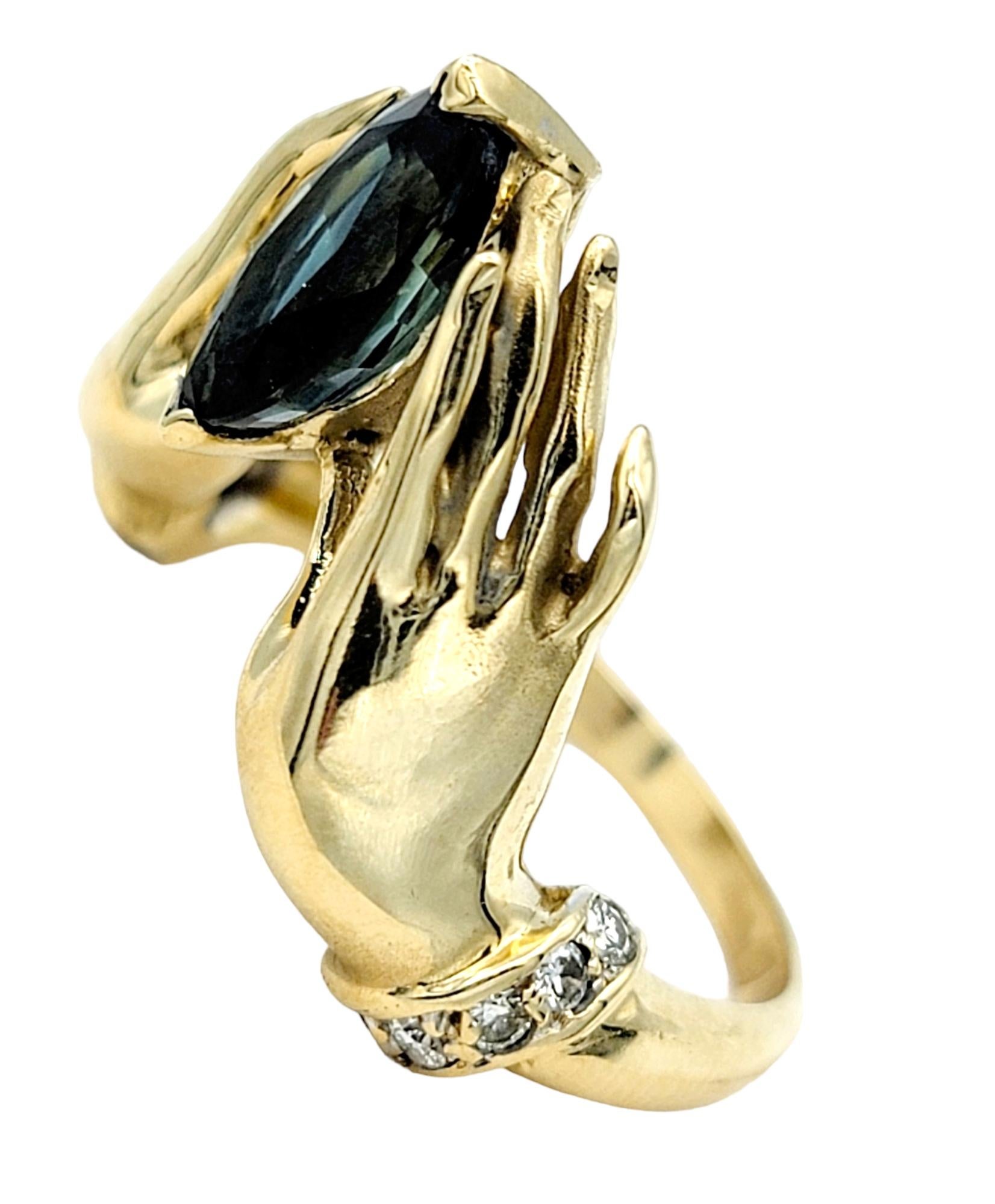 Contemporary Unique Bejeweled Graceful Hands Holding Marquis Sapphire 14K Yellow Gold Ring For Sale