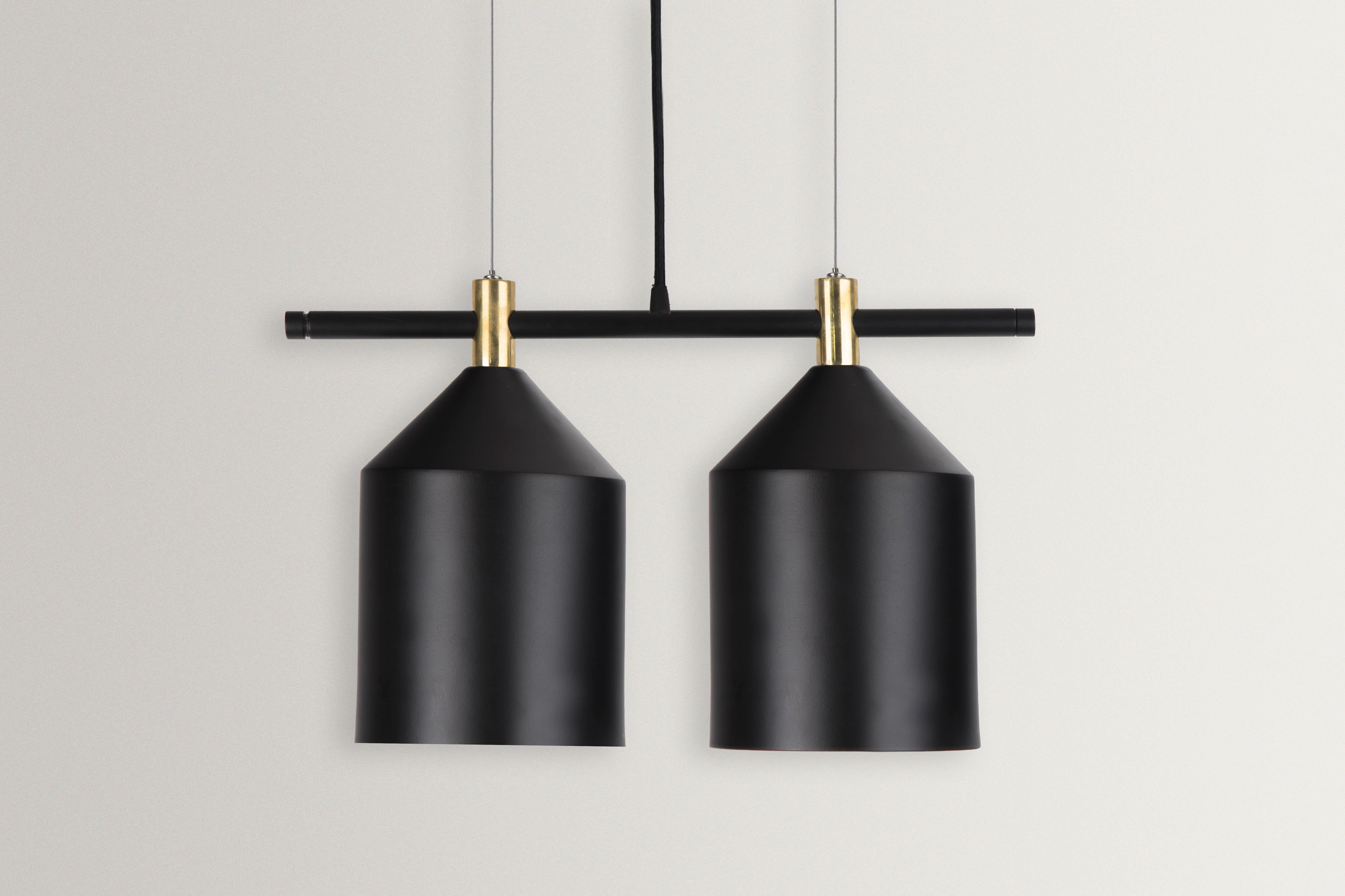 Unique 4 Tube pendant light by Hatsu
Dimensions: W 42 x H 26 cm 
Materials: Powdercoated Aluminium, Brass Fabric Cord

Hatsu is a design studio based in Mumbai that creates modern lighting that are unique and immediately recognisable. We started