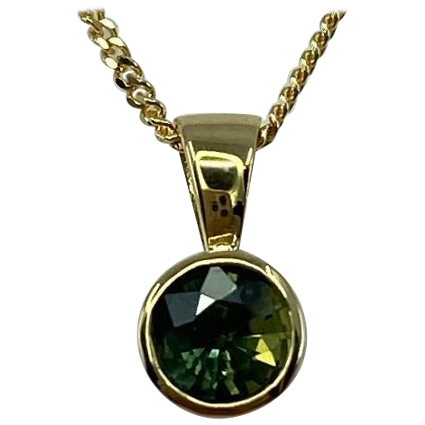Unico ciondolo bi-colore in oro giallo 18k con zaffiro verde non trattato