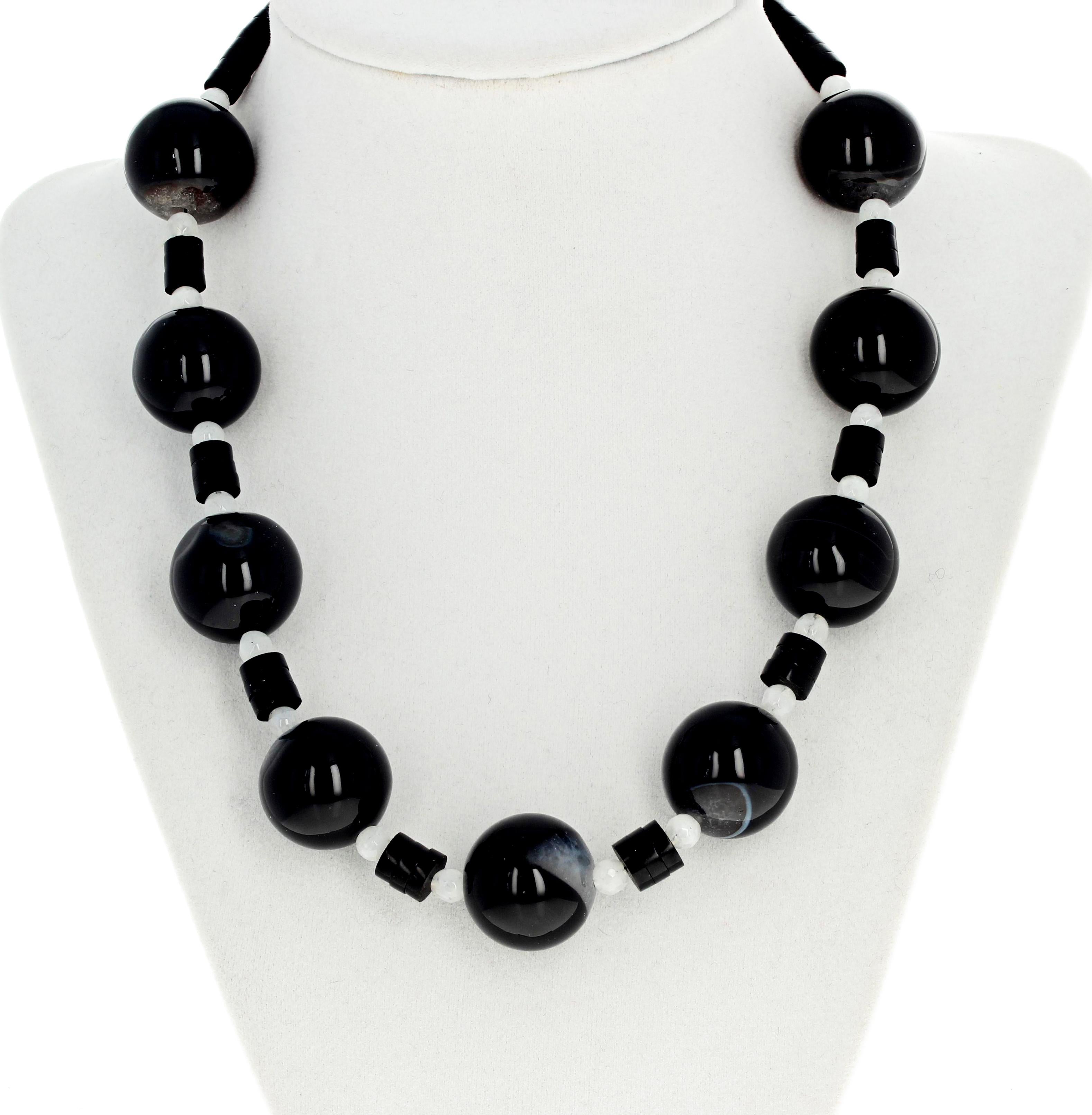 Highly polished glowing black and white Agate gemstones (18 mm) enhanced with unique shining  round slices of black Jet (black Amber) and glowing white checkerboard gemcut Moonstones all make up this gorgeous 17 1/2 inch necklace.  This is truly