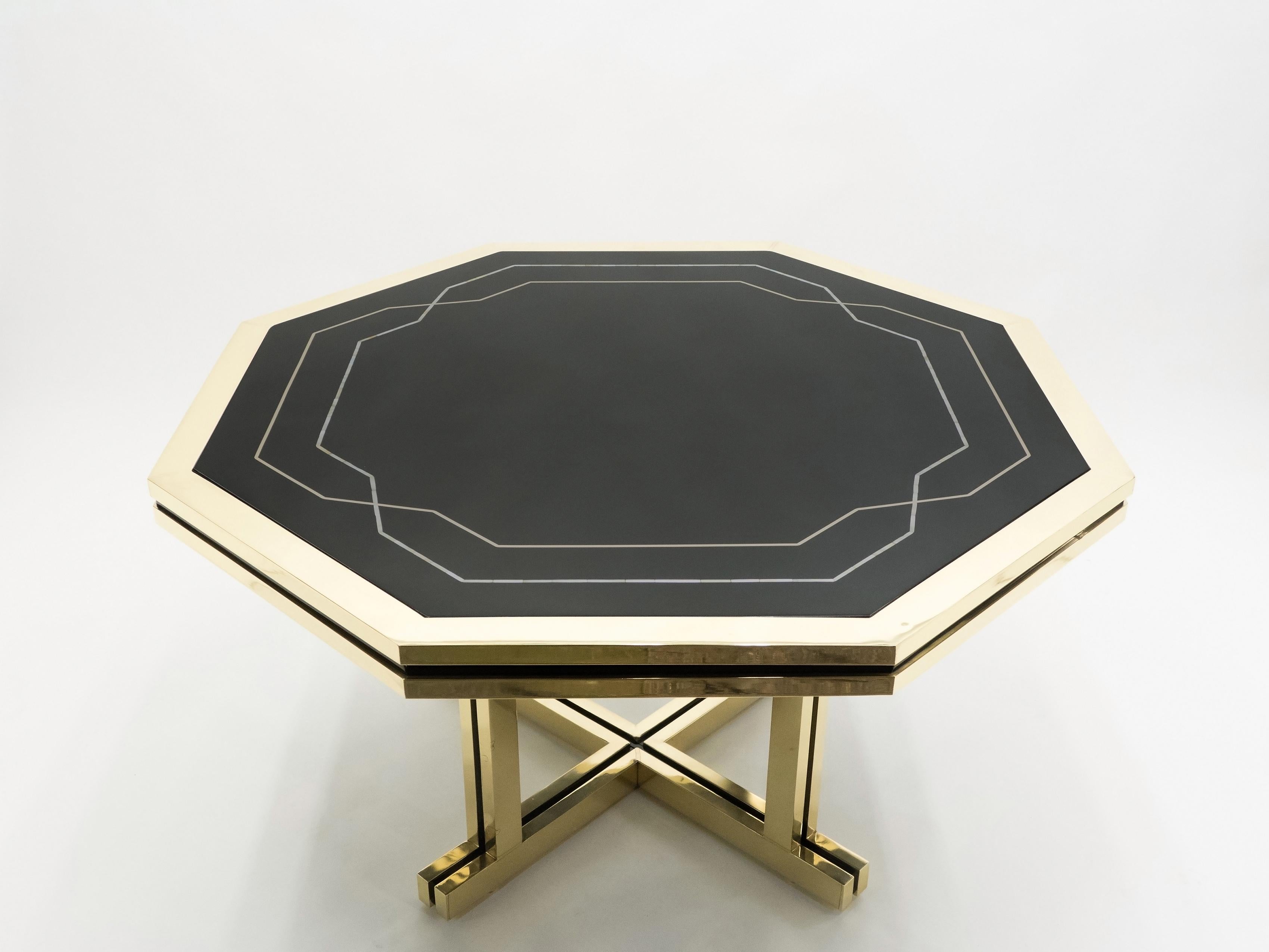 A rare piece from Maison Jansen, this octagonal dining table was a commission by a private client. With its impeccable design, perfect proportions, and high-end materials like mother of pearl lacquer and brass, it was likely a hugely expensive