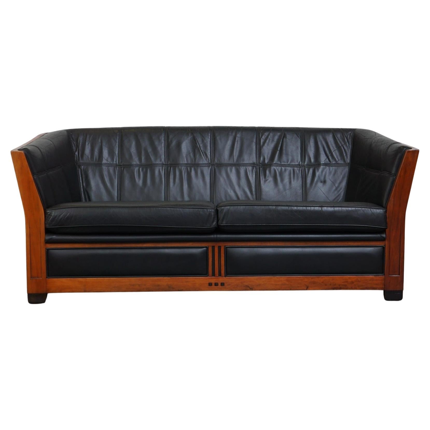 Unique black leather and wooden Art Deco design 2.5-seater sofa with a stunning  For Sale