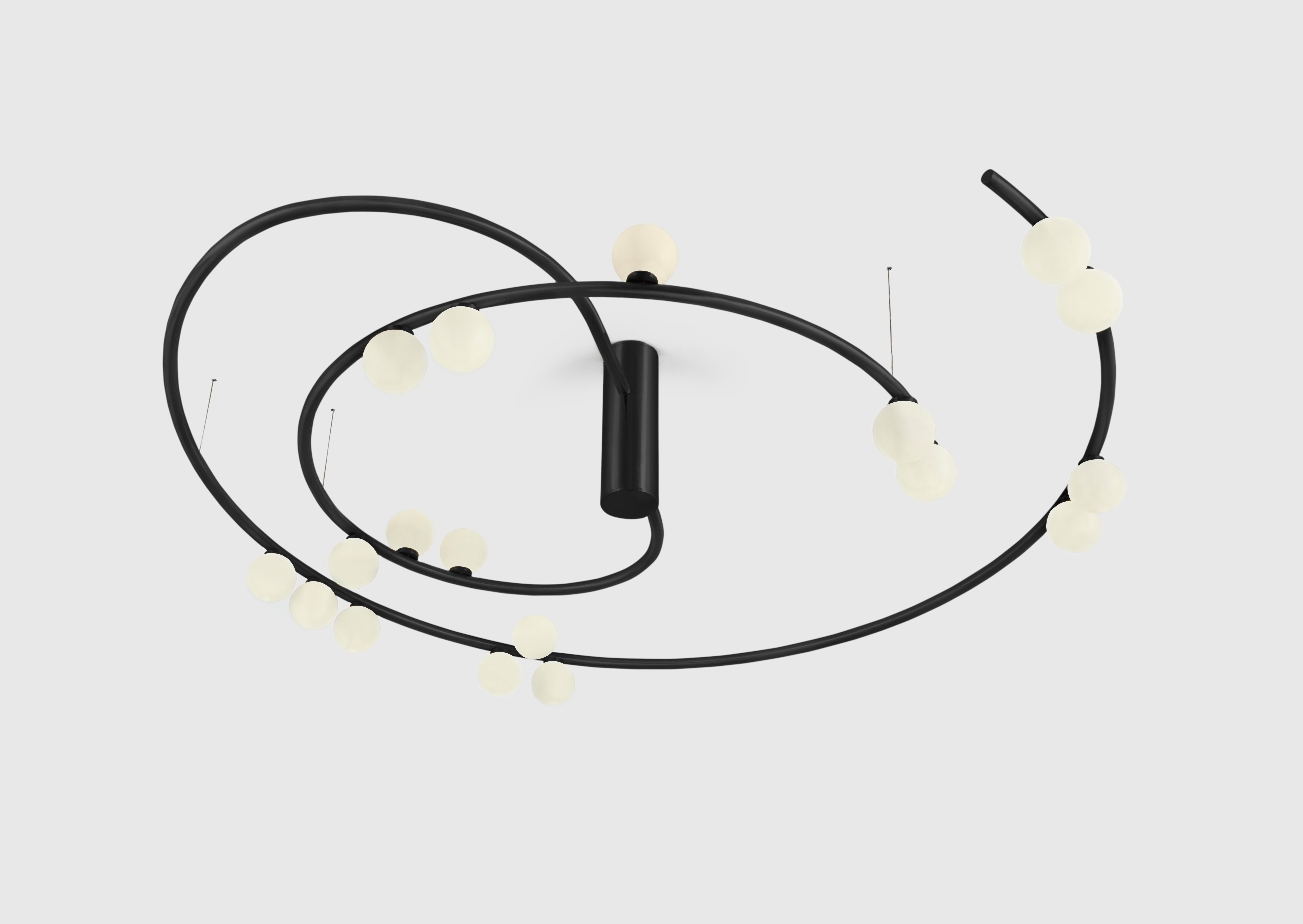 Unique black swirl chandelier by Saumil Suchak
Dimensions: D 130 x W 123 cm 
Materials: Brass, Glass

Hatsu is a design studio based in Mumbai that creates modern lighting that are unique and immediately recognisable. We started with an idea to
