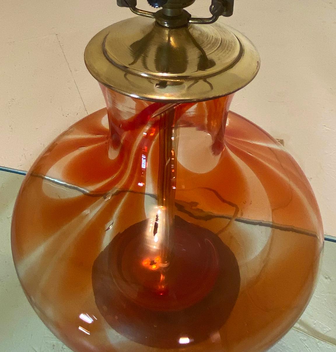 The Charimsa series by John Nickerson for Blenko of 1972 is a highly regarded and collectible line of the art glass from the Blenko Studios of Milton, WV. This bulbous table lamp is very uncommon and is believed to be the only example of a lamp ever