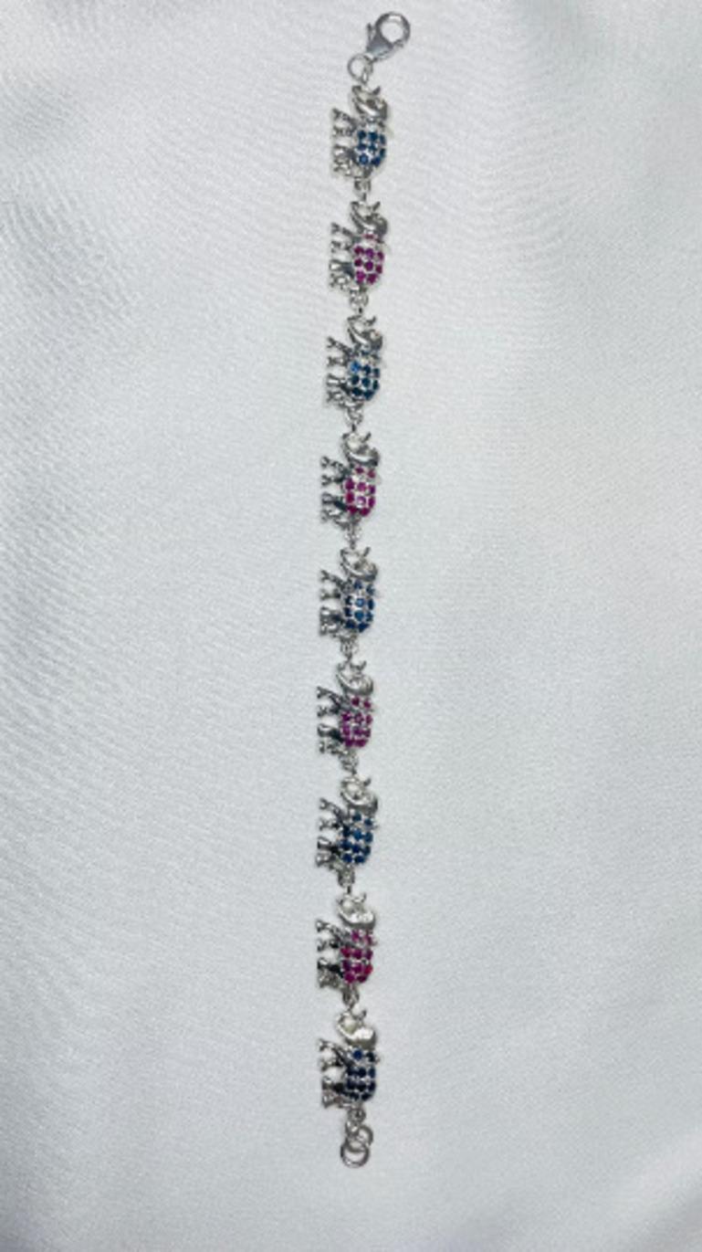 Contemporary Unique Blue Sapphire and Ruby Studded Elephant Bracelet in 925 Sterling Silver For Sale