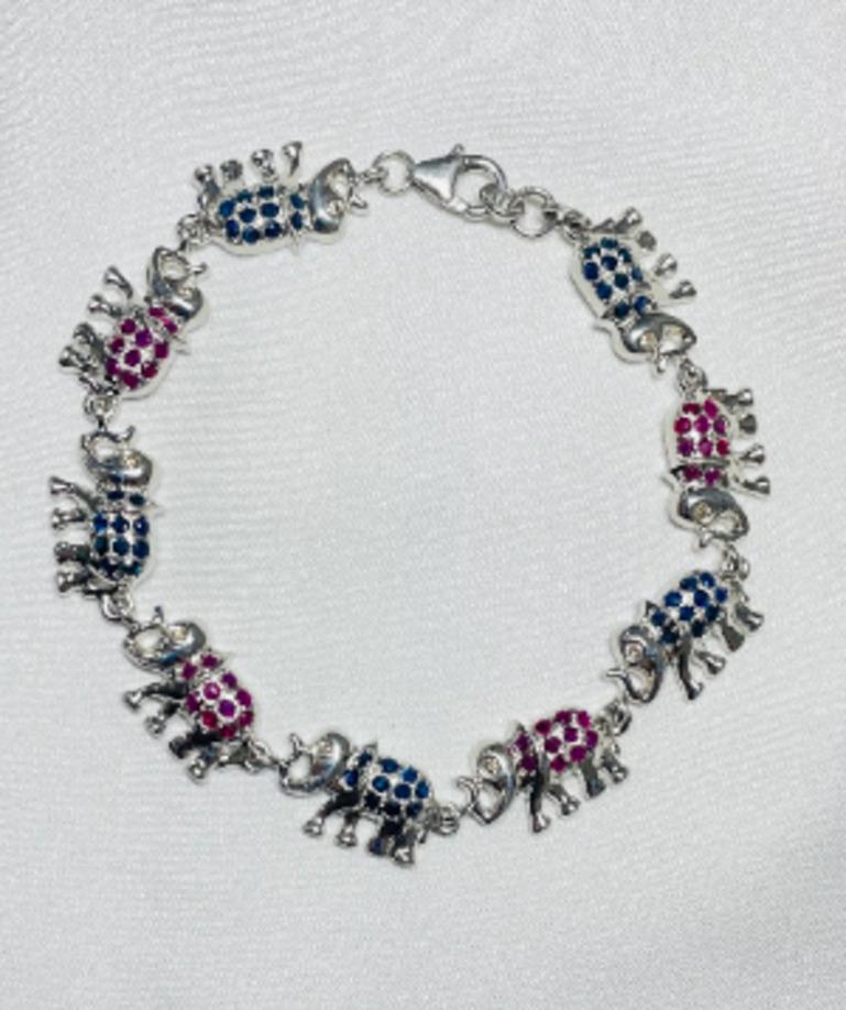 Unique Blue Sapphire and Ruby Studded Elephant Bracelet in 925 Sterling Silver In New Condition For Sale In Houston, TX