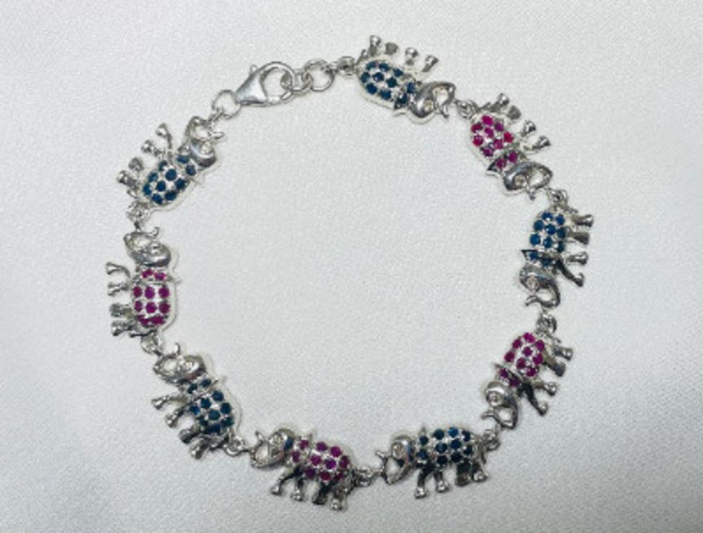 Women's Unique Blue Sapphire and Ruby Studded Elephant Bracelet in 925 Sterling Silver For Sale
