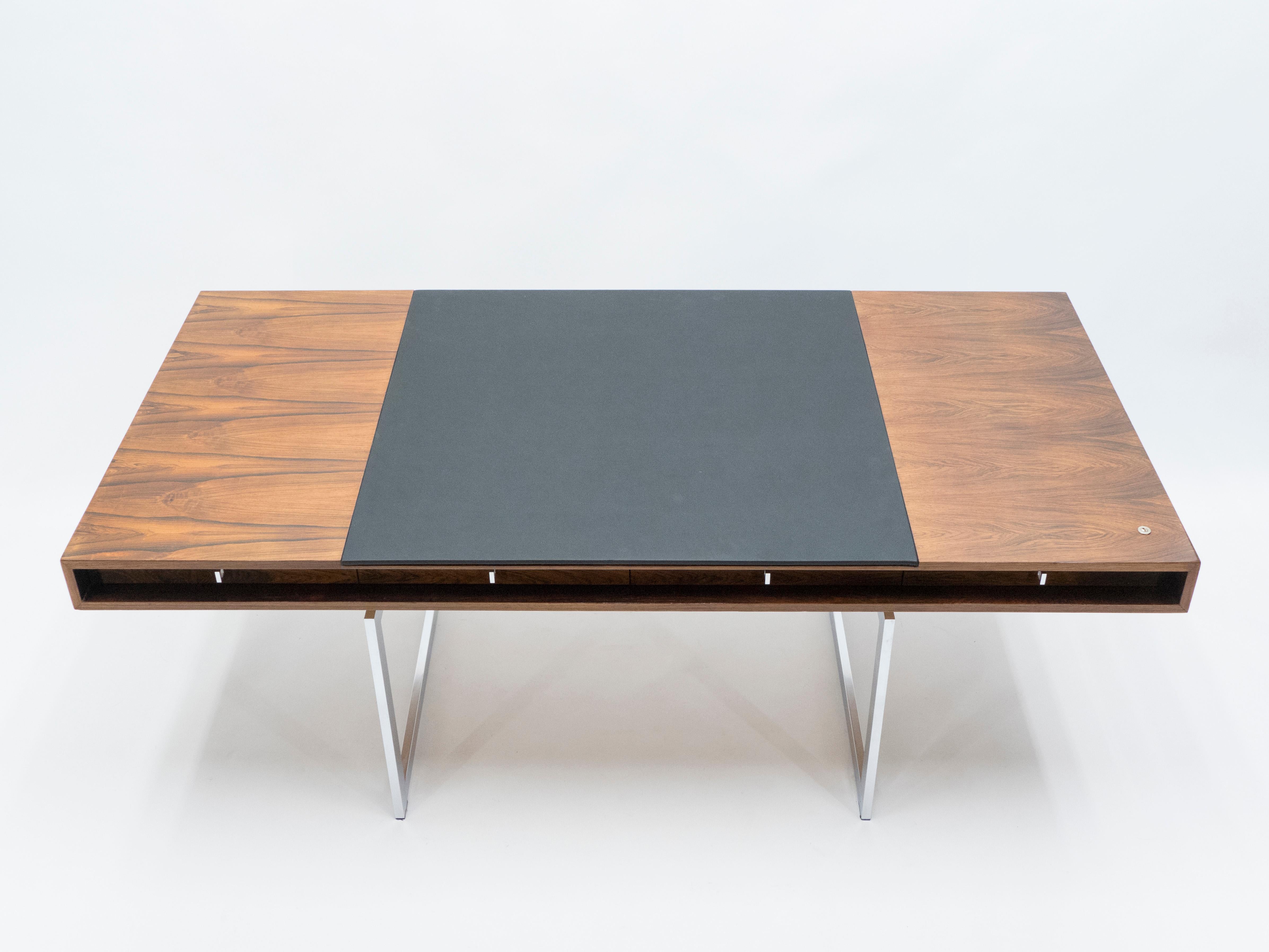 This is a unique desk, called the “working table” by Bodil Kjaer when she designed it in 1959. Produced by E. Pedersen & Søn in Denmark, this particular piece was made on request in the early 1960s with an adjusted leather top, in Brazilian Rosewood