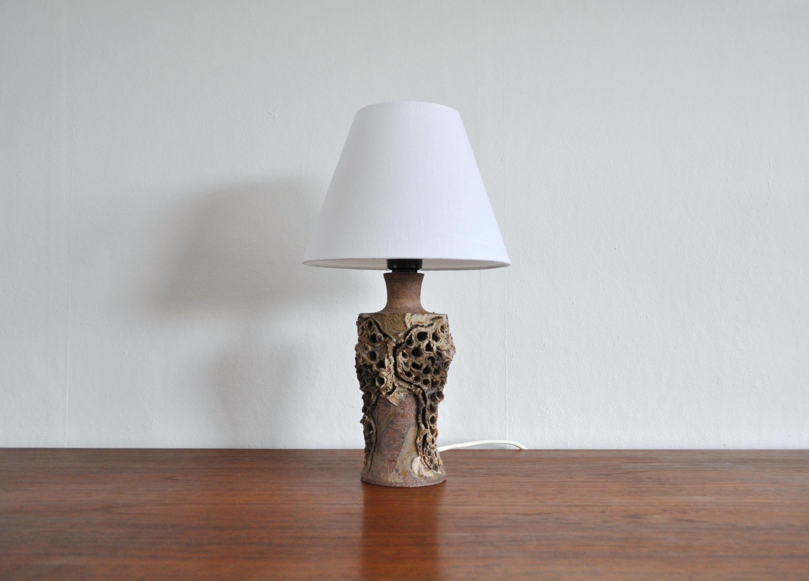 Unique handmade Danish Mid-Century Modern ceramic table lamp by Bodil Marie Nielsen. 
Height with shade 36 cm, height to socket 27 cm.
Shade dimensions H 15 cm x 10/20 cm.
Good vintage condition with small signs wear.
Light source: E27 Edison