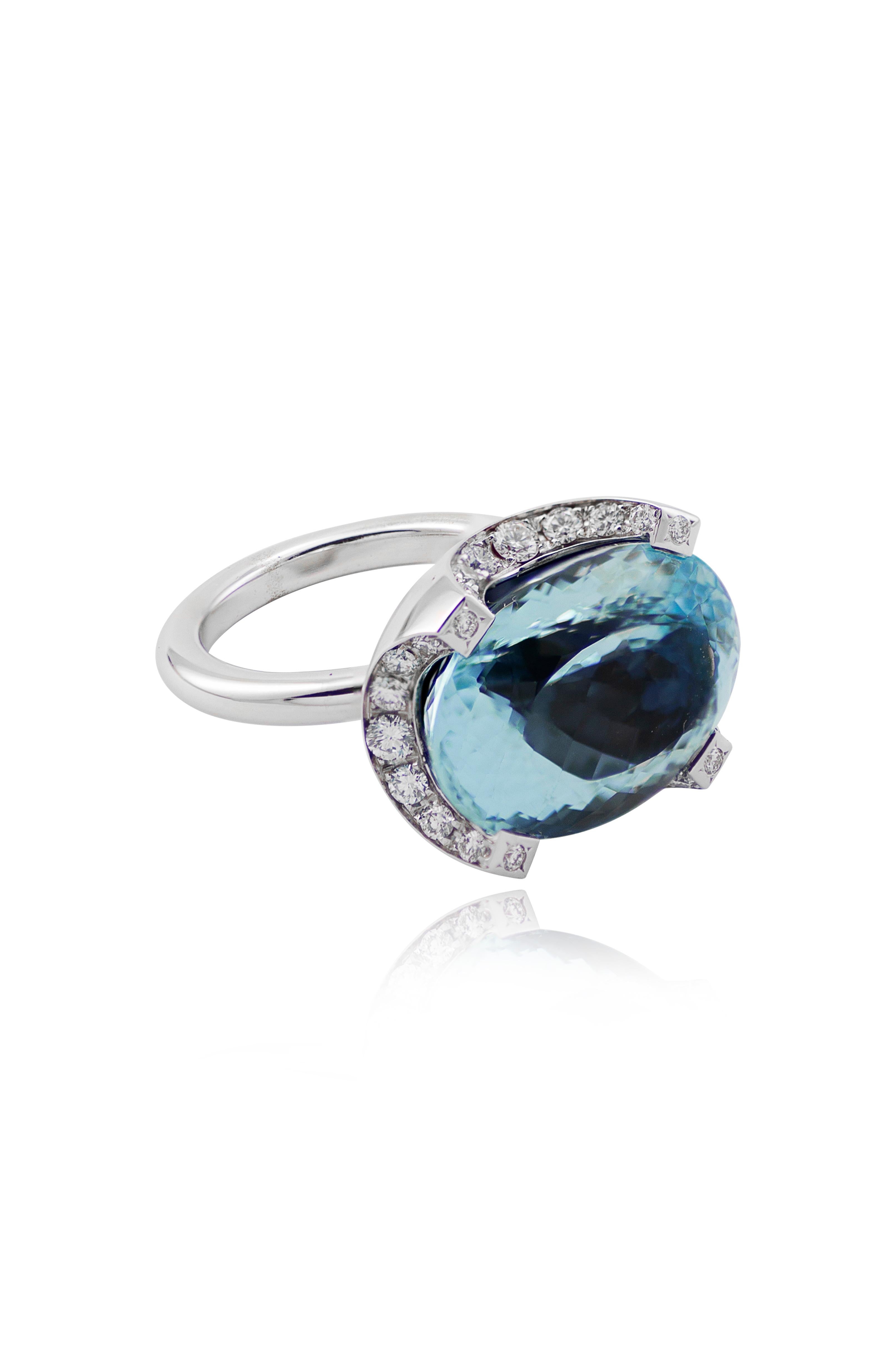 Handcrafted in Margherita Burgener family workshop, Italy,  the ring is centering an oval Brazilian aquamarine.
An evergreen contemporary design ring. 
4 diamonds are set on the upper parte of the design.
18 KT white gold grams 9.91
n. 32 diamonds