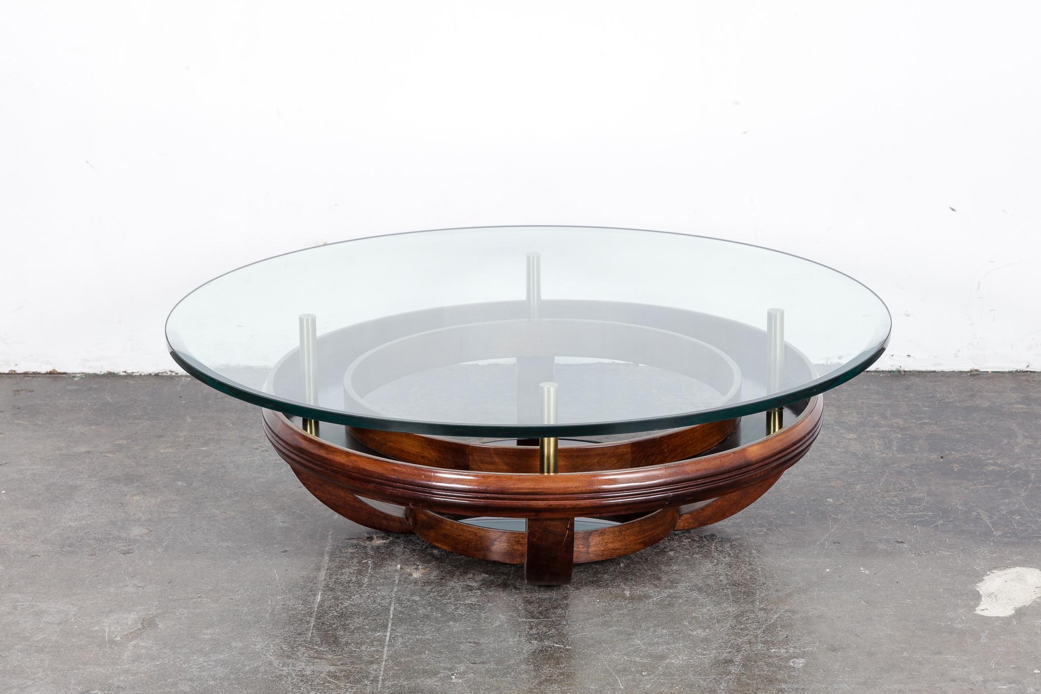 Brazilian bi-level round coffee table with brass supported glass top and black lacquered inside ring, wood base. 1960s. Original glass top.