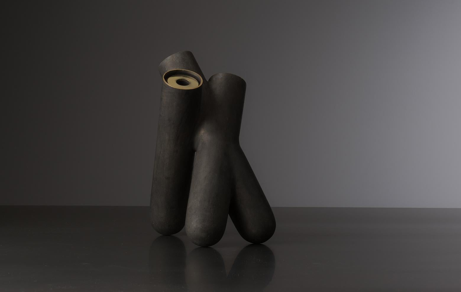 The Mol vase is a unique piece from a collection of ten different vases, sculpted and cast with direct lost wax method.
The bronze Vase with matte black patina gives strong character with a gentle personality. The cap can be removed and the
interior