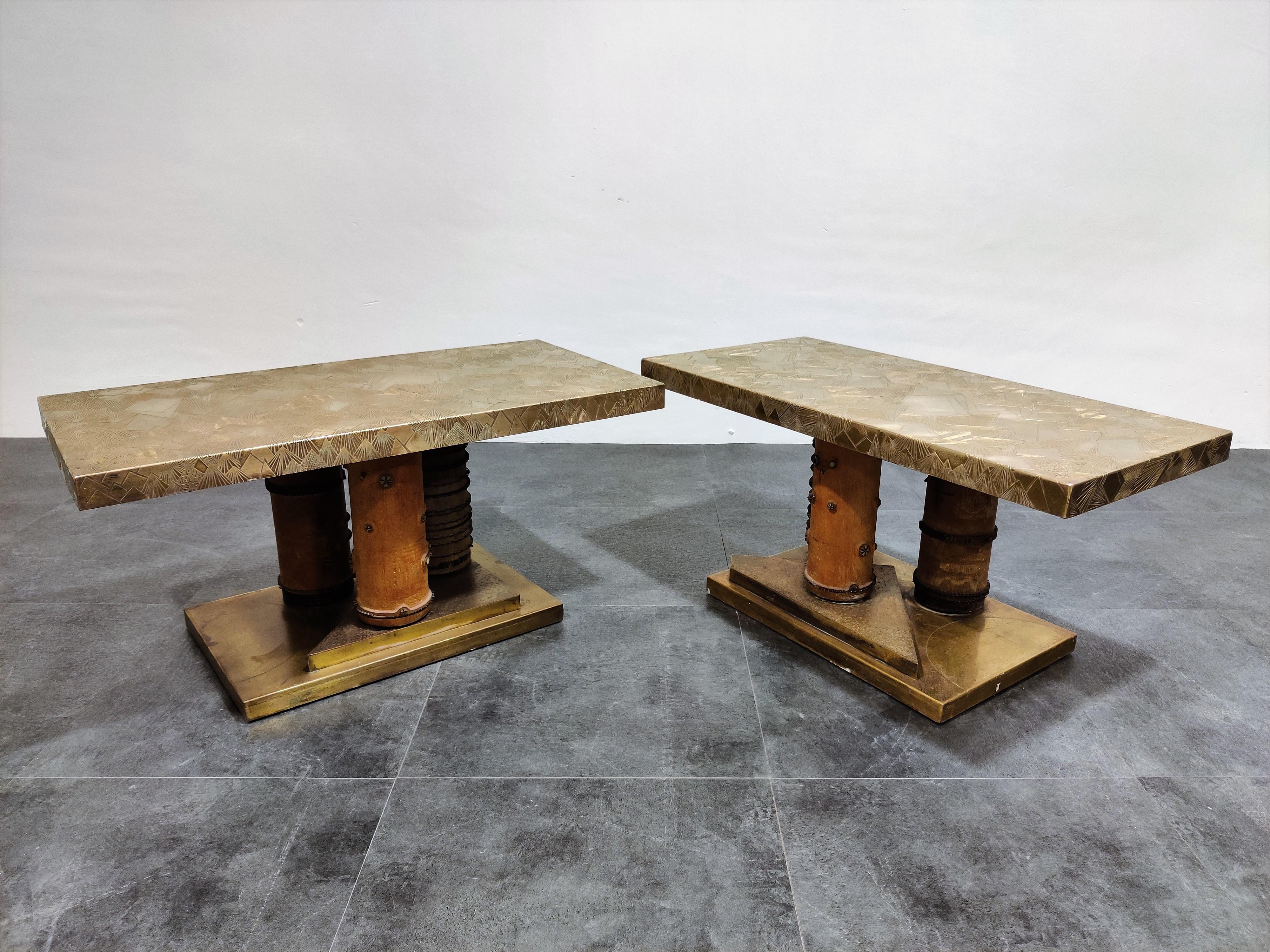 Unique Brutalist coffee tables or side tables.

These tables consist of an etched brass tabletop mounted on unique sculpted wooden legs.

Unknown designer but manufactured in France in the 1970s.

These gems are unique in their design and are