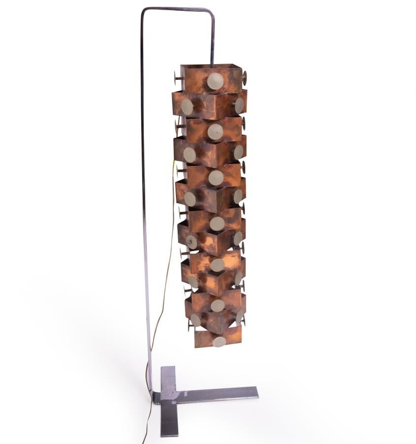 A truly unique piece, this copper brutalist floor lamp was custom-made for a well-known actress during the 1980s and placed in her home in Geneva.

The round circles have been referred to as raindrops, this piece is made of copper and left to age,