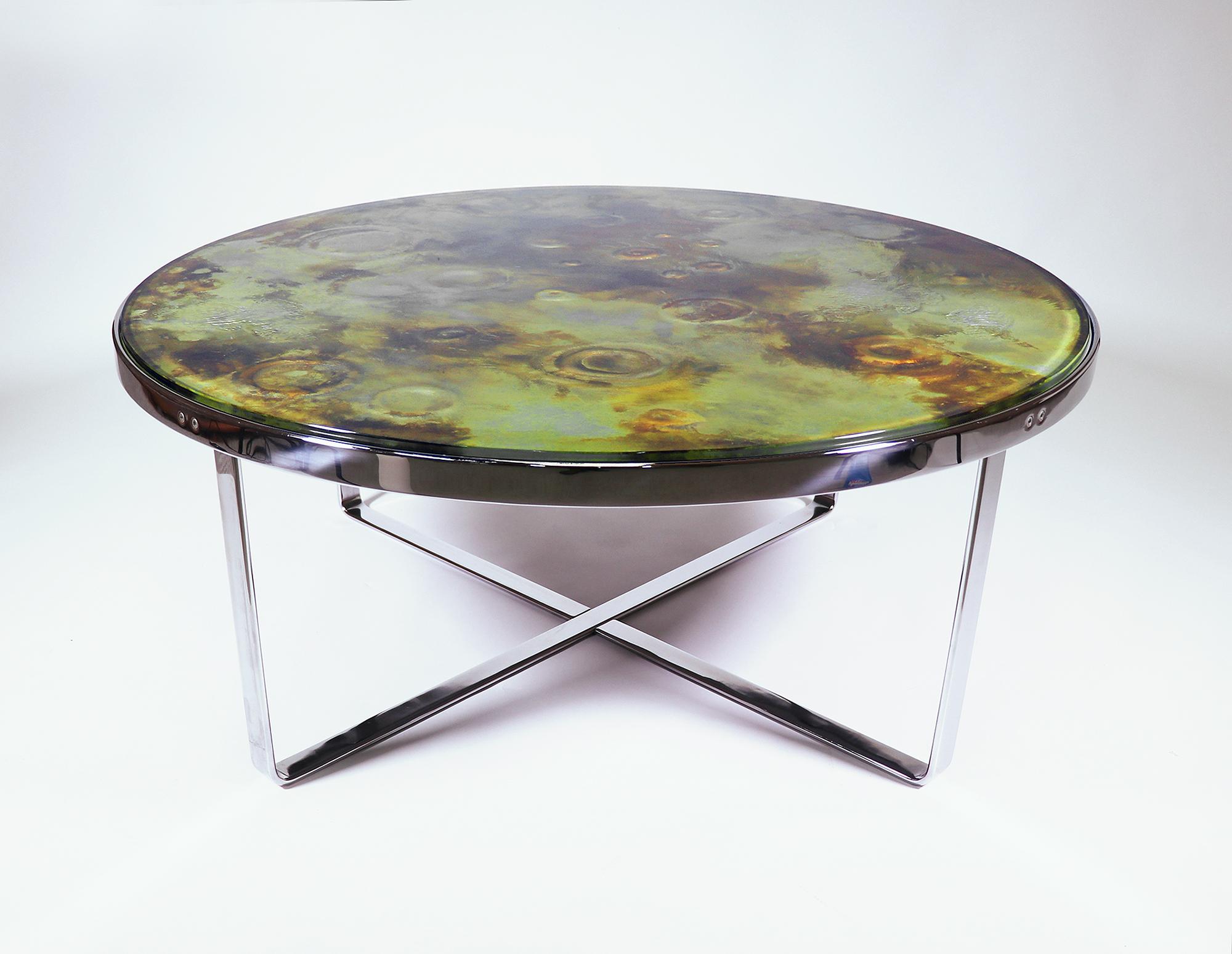 Unique brutalist one-off moon crater artwork side or coffee table consisting of a heavy glass/onyx top and a chrome-plated metal frame. The craters have plastic indentations which can be seen from above through the transparent surface. The Brutalist