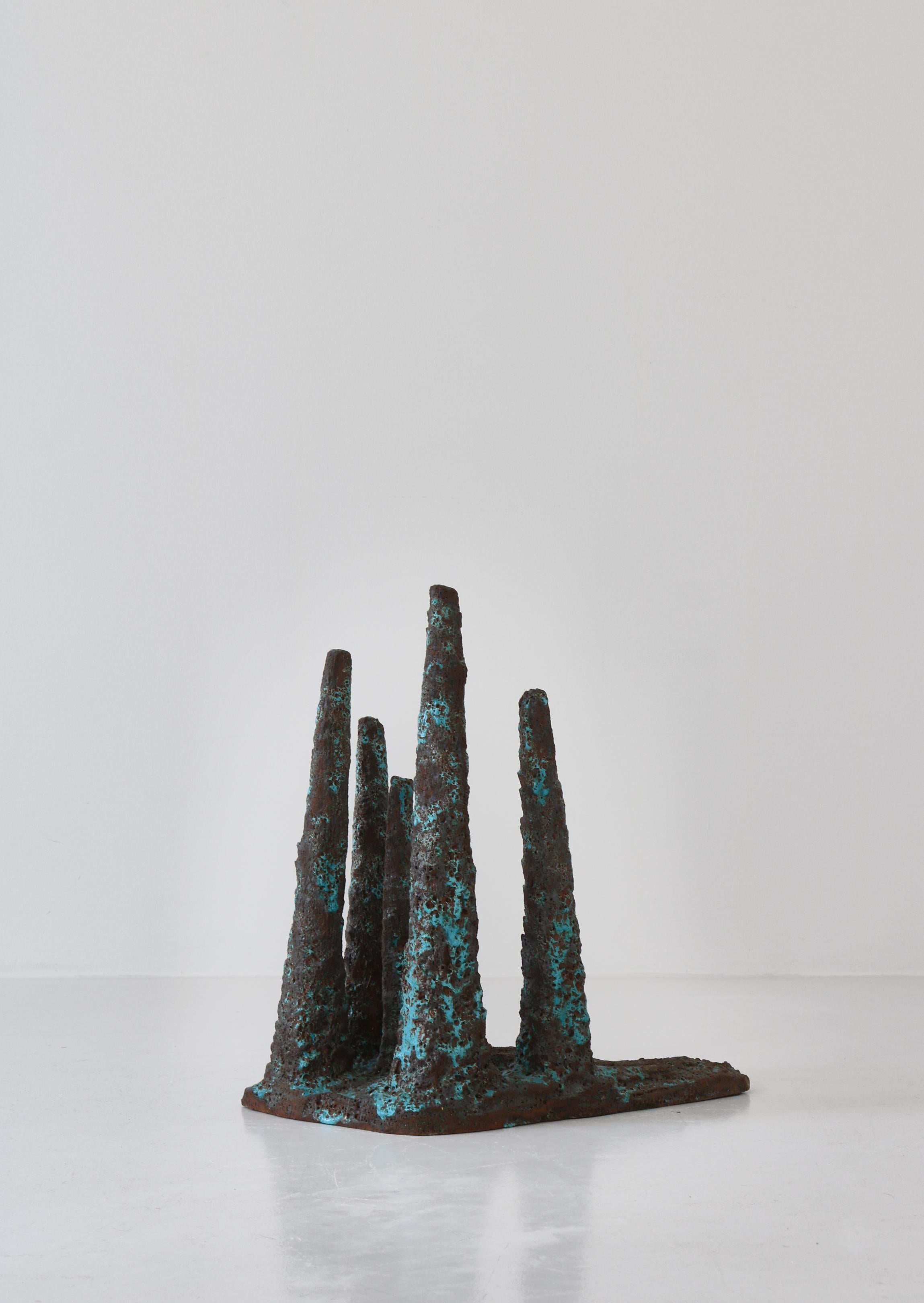 Unique large floor sculpture by Danish artist Ole Bjørn Krüger (1922-2007) made in the 1960s in his own workshop. Abstract stalagmite columns hand sculpted in dark stoneware with a shiny blue glazing. Krüger was known for a very expressive style of