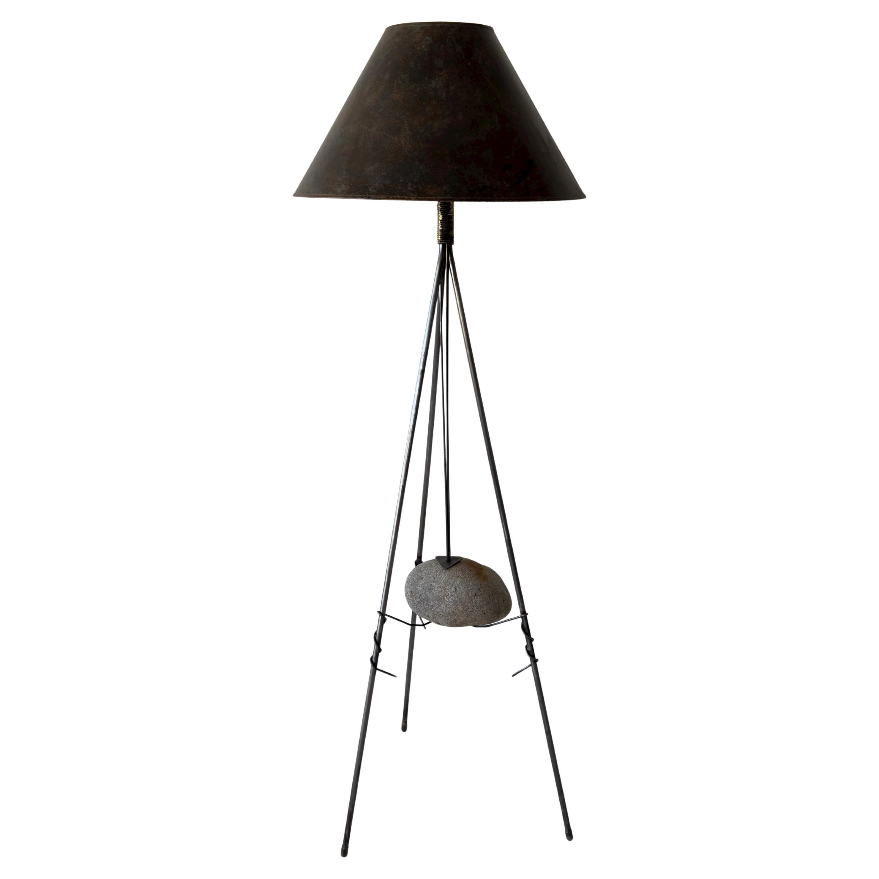 unique brutalist suspended stone floor lamp with twisted metal