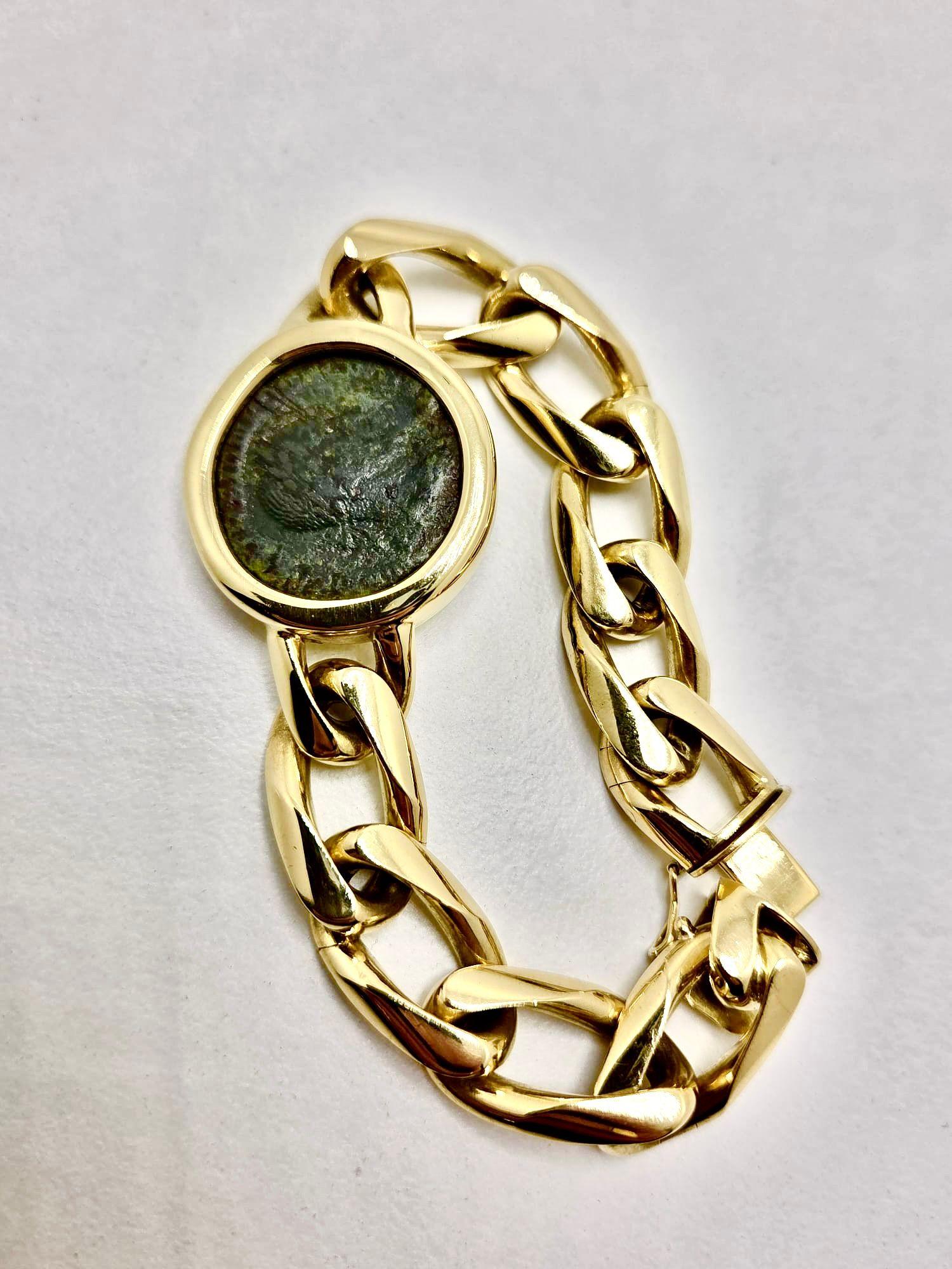 A unique Bulgari vintage coin bracelet from the 1970s, masterfully handcrafted in solid yellow gold with an impressive weight of 104.50 grams. This one-of-a-kind jewel showcases an authentic ancient Roman coin depicting Emperor Domitian (reigned