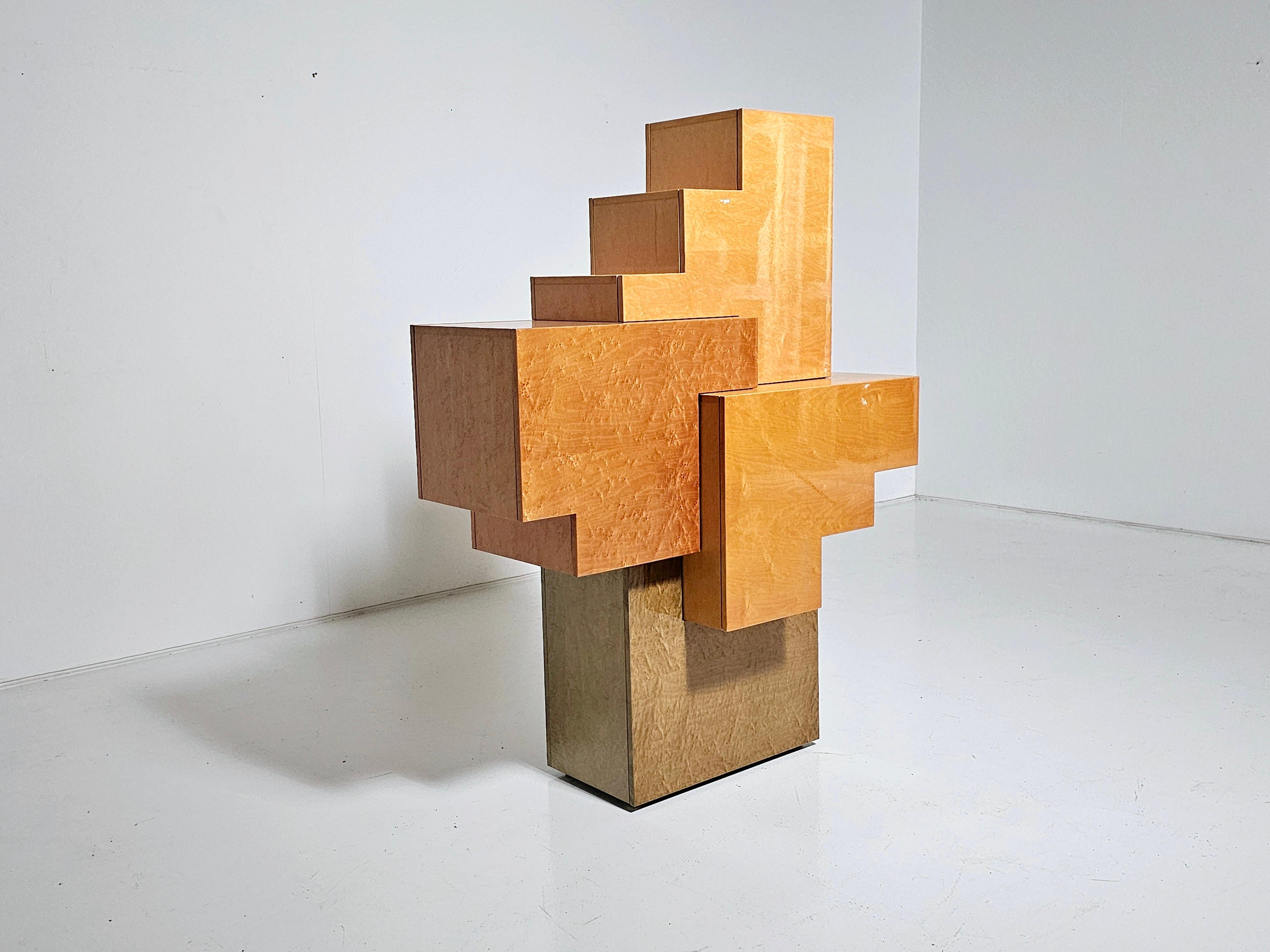 Unique sculptural cubist cabinet made in Italy in the 1990s. Made from Burlwood in different tones and colors. Very high-quality piece. Most likely one of a kind. It can be used freestanding.

The combination of yellow, orange, and green colors