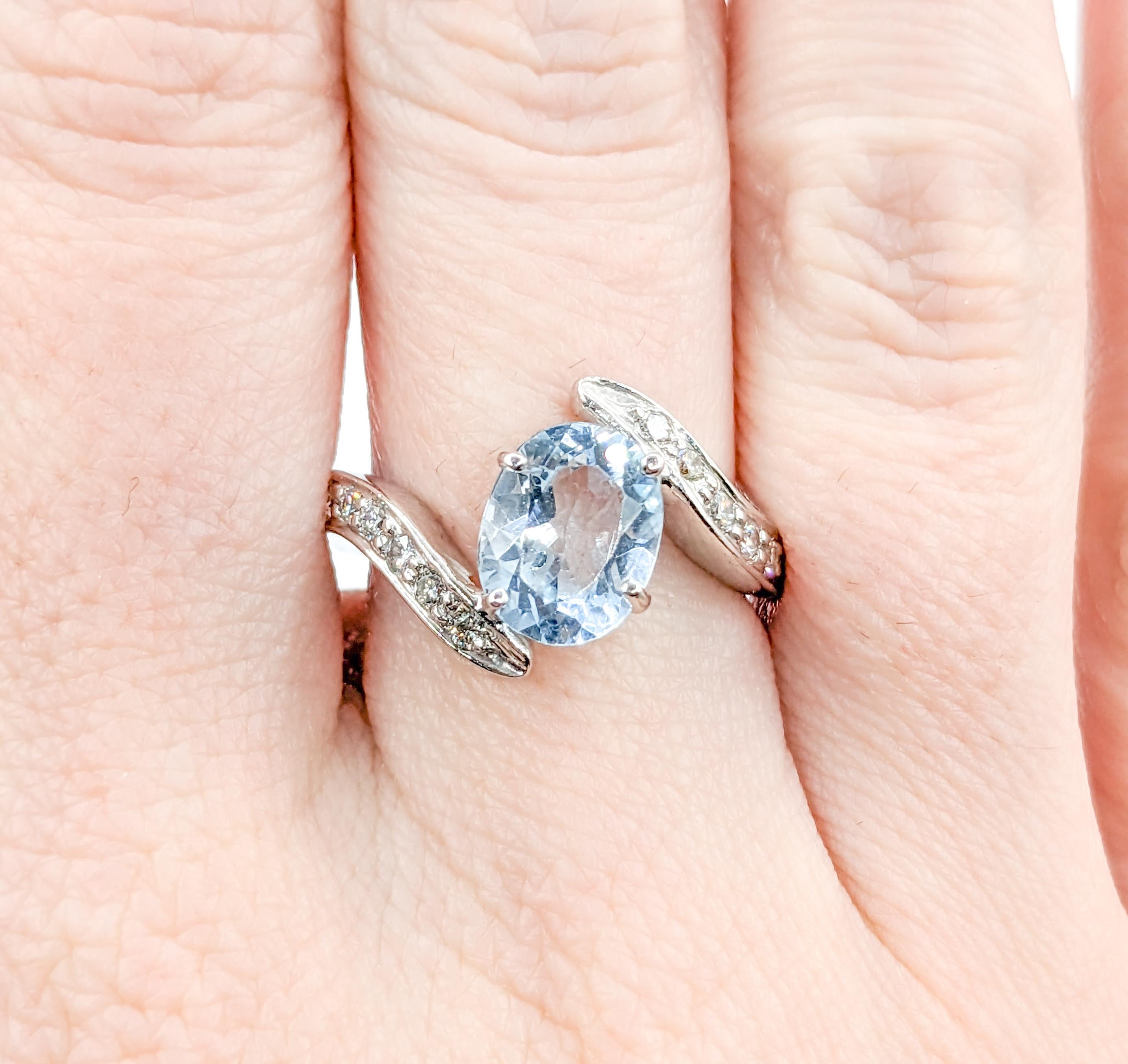 Unique Bypass Aquamarine & Diamond Ring in White Gold

Elevate your style with this exquisite 14k white gold ring, a true embodiment of beauty and sophistication. This stunning piece showcases a captivating 1.75 carat oval cut Aquamarine alongside a