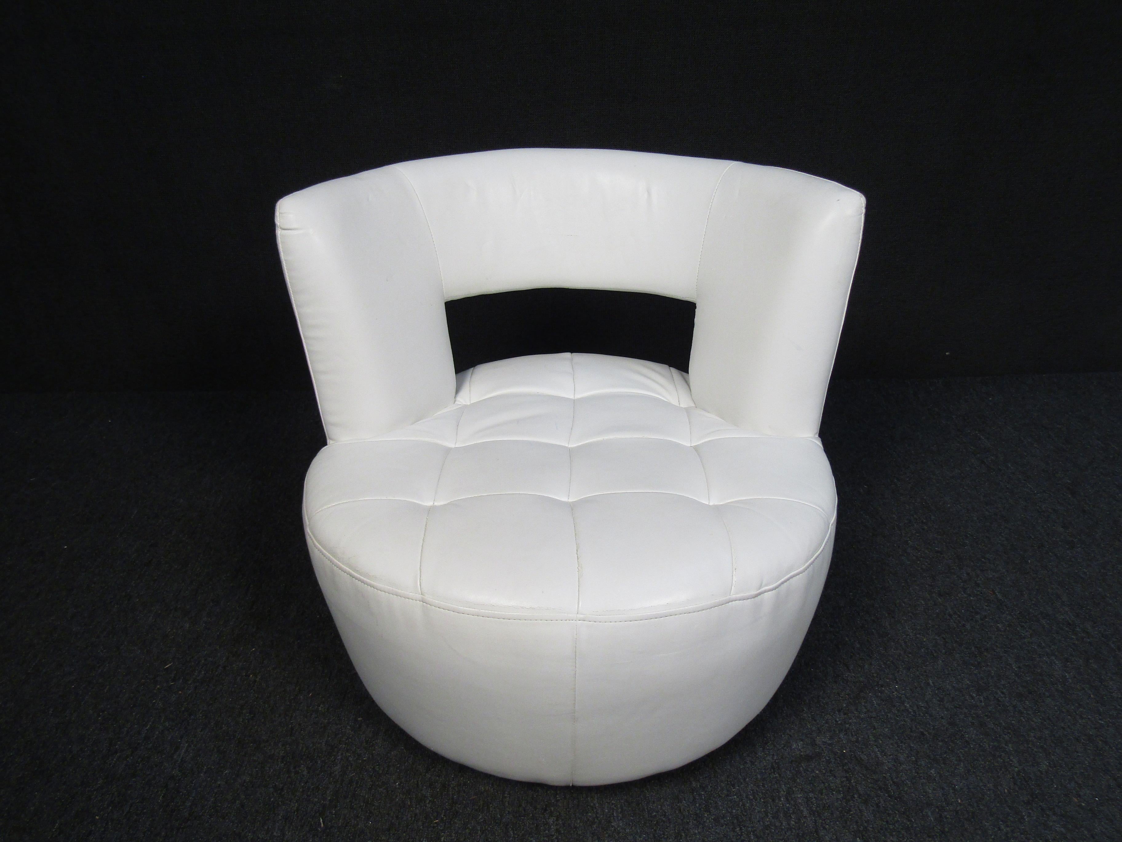 Have a seat in this ultra complementary but comfortable Carlo Perazzi leather chair. A unique modern design makes this piece stand out. This unique chair features a swiveling base, white leather and a tufted seat cushion. 

 Please confirm item
