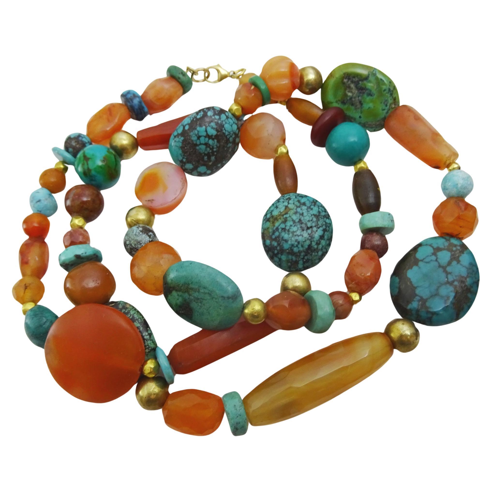 A unique long flapper type necklace which is composed of various size and shapes of carnelian beads ,
 various turquoise beads the big ones being Tibetan turquoise along with natural Chinese turquoise and also some reconstructed Turquoise beads ,
