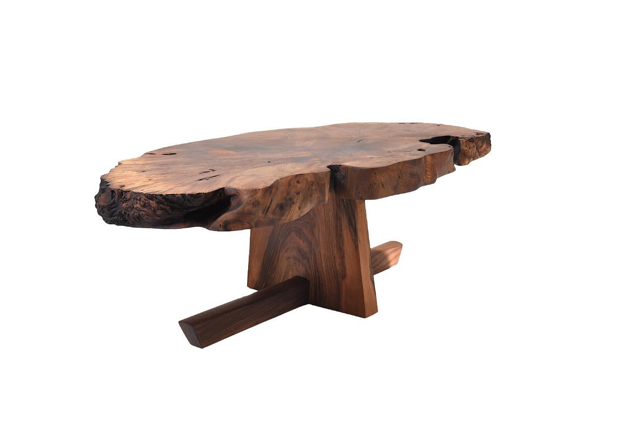 Unique Caucasian walnut table - signed by Jörg Pietschmann
Caucasian walnut with a revers t-Stand crafted from a beautiful grained and banded European walnut.
The tabletop shows a exquisite, partly burly, landscape from the life of this majestic