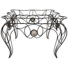Table centrale / console unique en fer forgé et verre par Andre Dubreuil, 1986