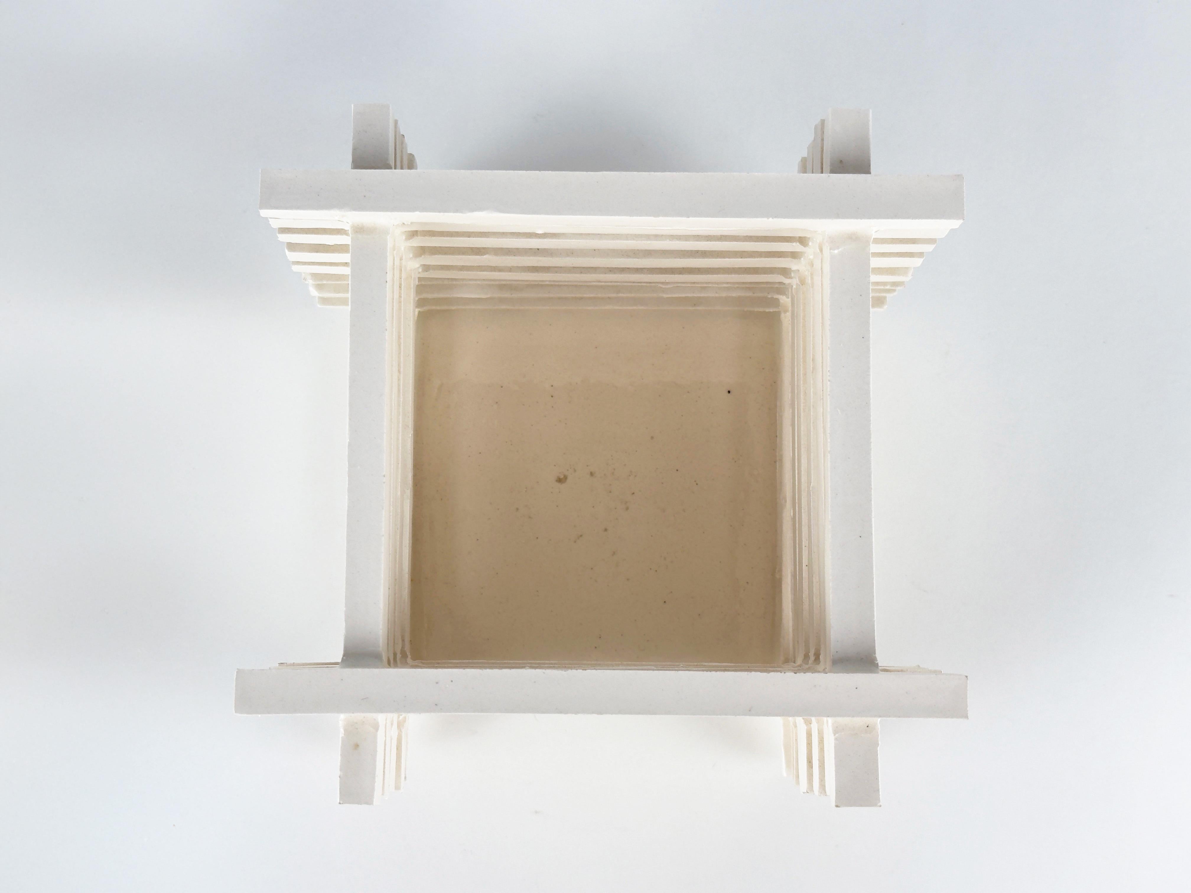 Unique Glazed ceramic stacked bar vessel in bone white. Beautifully complex yet elegant design in ceramic. In good condition. 

Shipping from Orange, Ca.