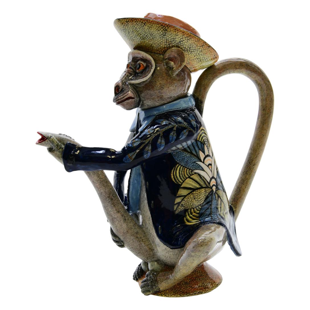 Introducing a truly unique masterpiece: the Monkey Teapot by Love Art Ceramic. Handcrafted with precision and passion, this teapot stands as a testament to the artistry of its creators.

Sculpted by the talented hands of Sfiso, each curve and
