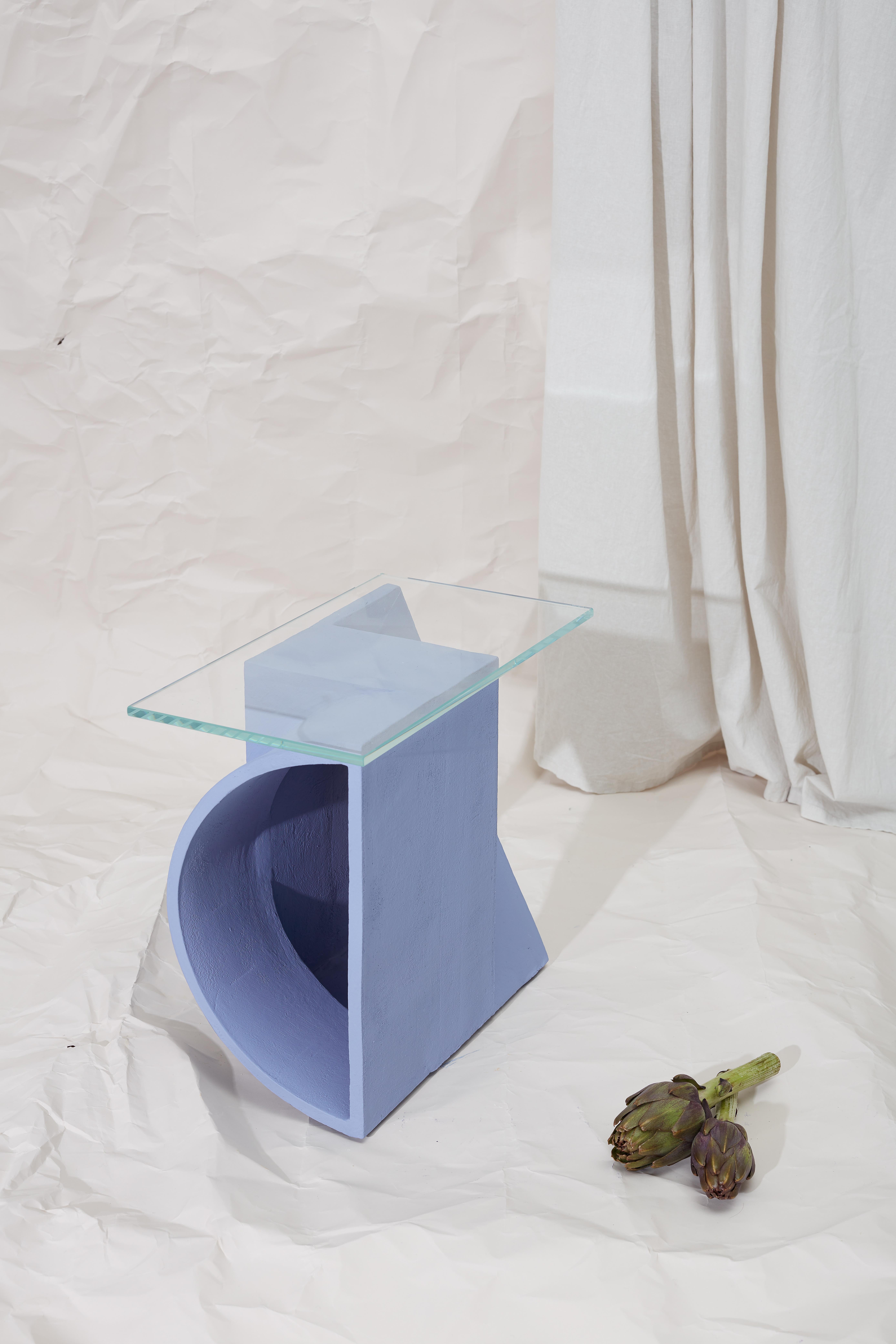 Ceramic side table by Theodora Alfredsdottir
Unique
Materials: Blue stoneware, clear glass
Dimensions: 40 x 40 x 20 cm
 Glass 25 x 44 x 0.6 cm 

A collection of ceramic side tables that explore the possibility of using a single mould to