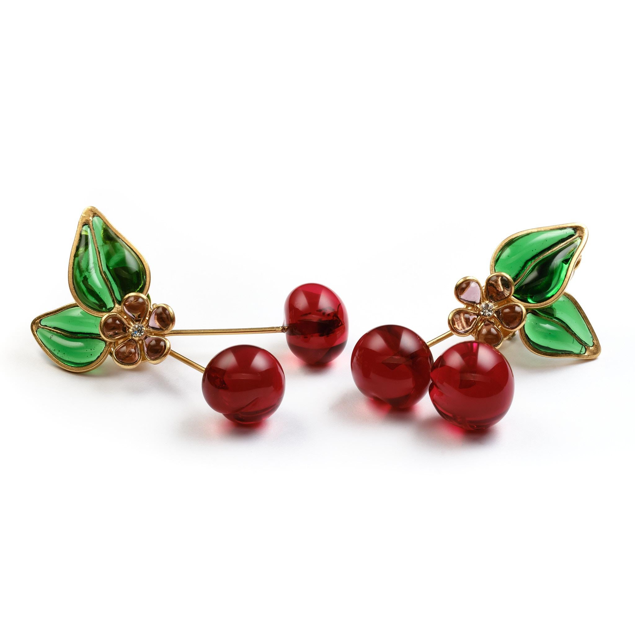 Beautiful and unique  Chanel ear clips in the shape of a pair of cherries with green leaves and a cherry blossom. These ear clips were made by Gripoix Paris in the 1970s and are very rare.
Measurement: Full length 6 cm/2,36 