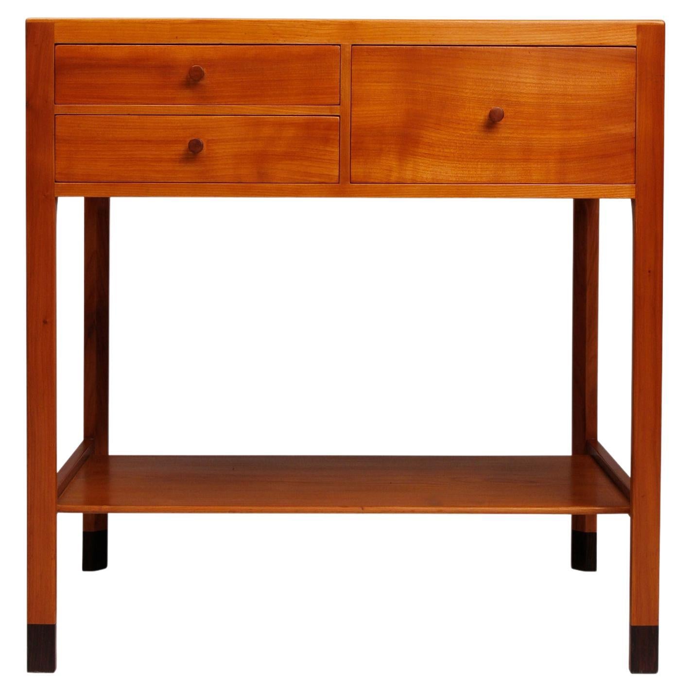 Danish modern cherry wood side table with drawers and shelf For Sale