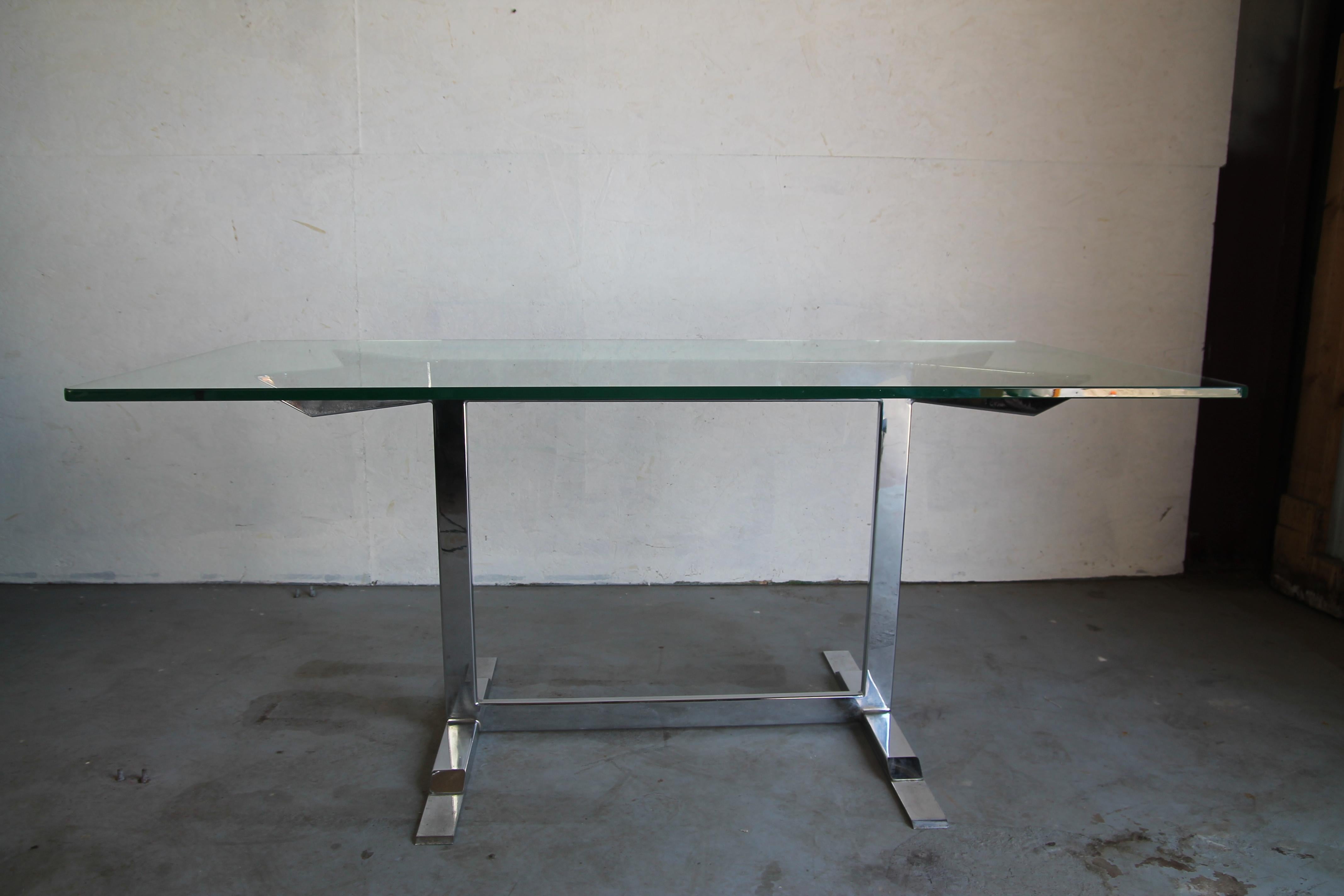 Great chrome and glass top table. This table can be used as a dining table or desk. This is the first time I have seen this base. In nice vintage condition.