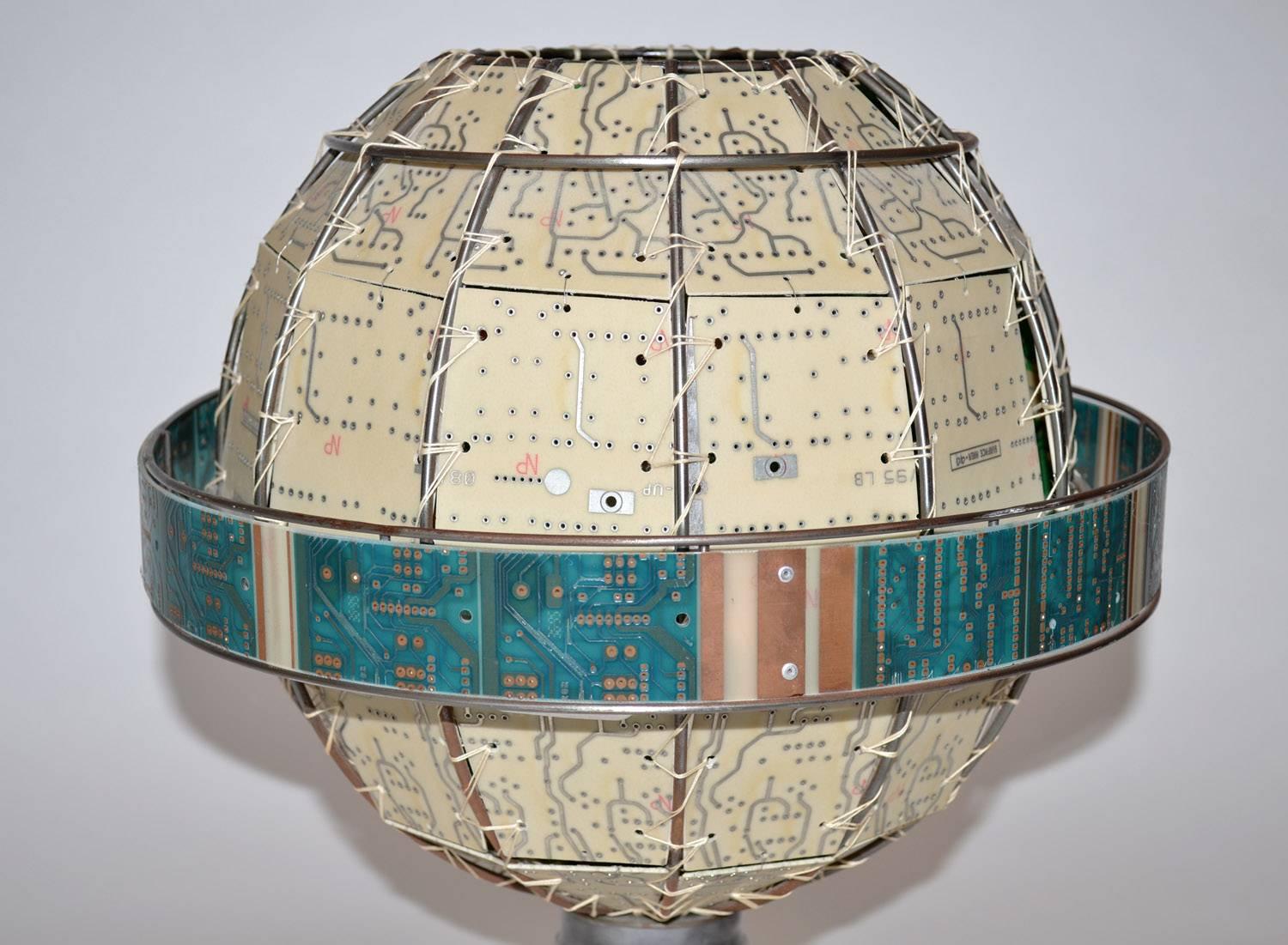Unique Studio Circuit Board Globe Table Lamp, Signed, USA, 1990's. One-off globe-shaped table or desk lamp comprised of weaved circuit board panels on welded wire frame, laced construction, internal light on legs of medical/ industrial stainless