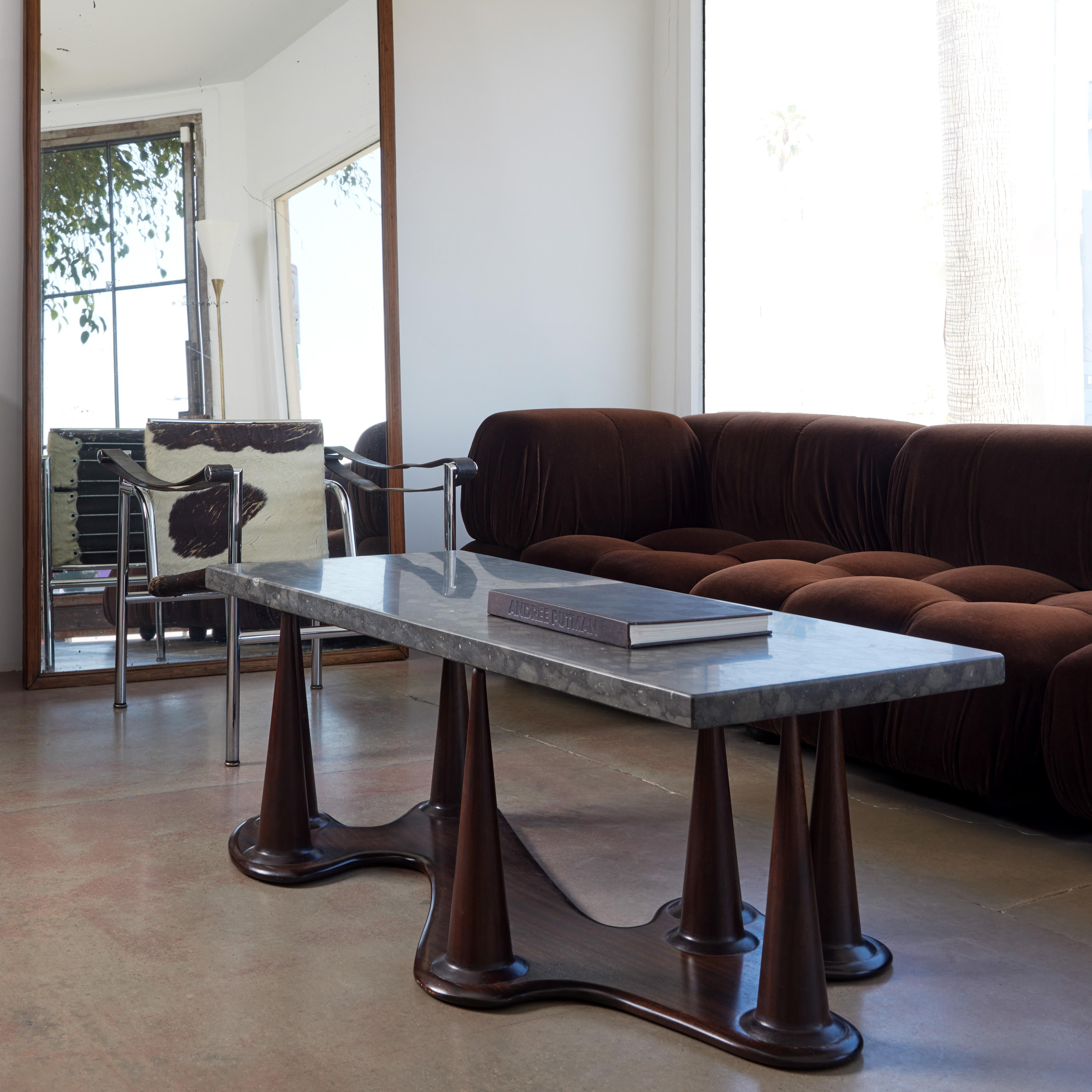 A unique coffee table with a sculptural mahogany base and rectangular fossilized marble top. Designed and made 1956 by Torsten Grundberg, Sweden.

Provenance: Designed in 1956 for Stockholm City Hall, Sweden.