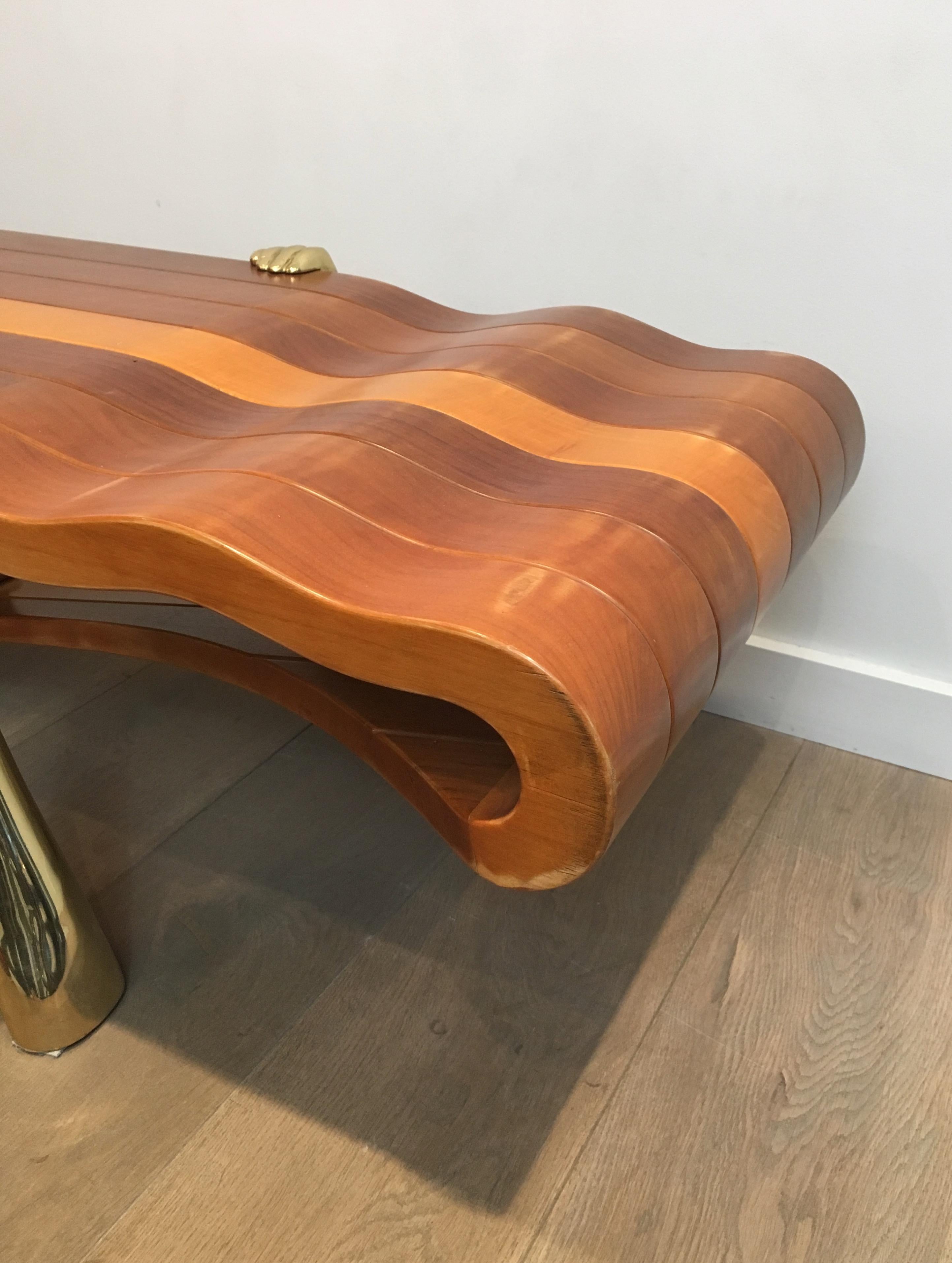 Unique Coffee Table Made of a Thick Freeform Wood Top Supported by Brass Arms For Sale 4