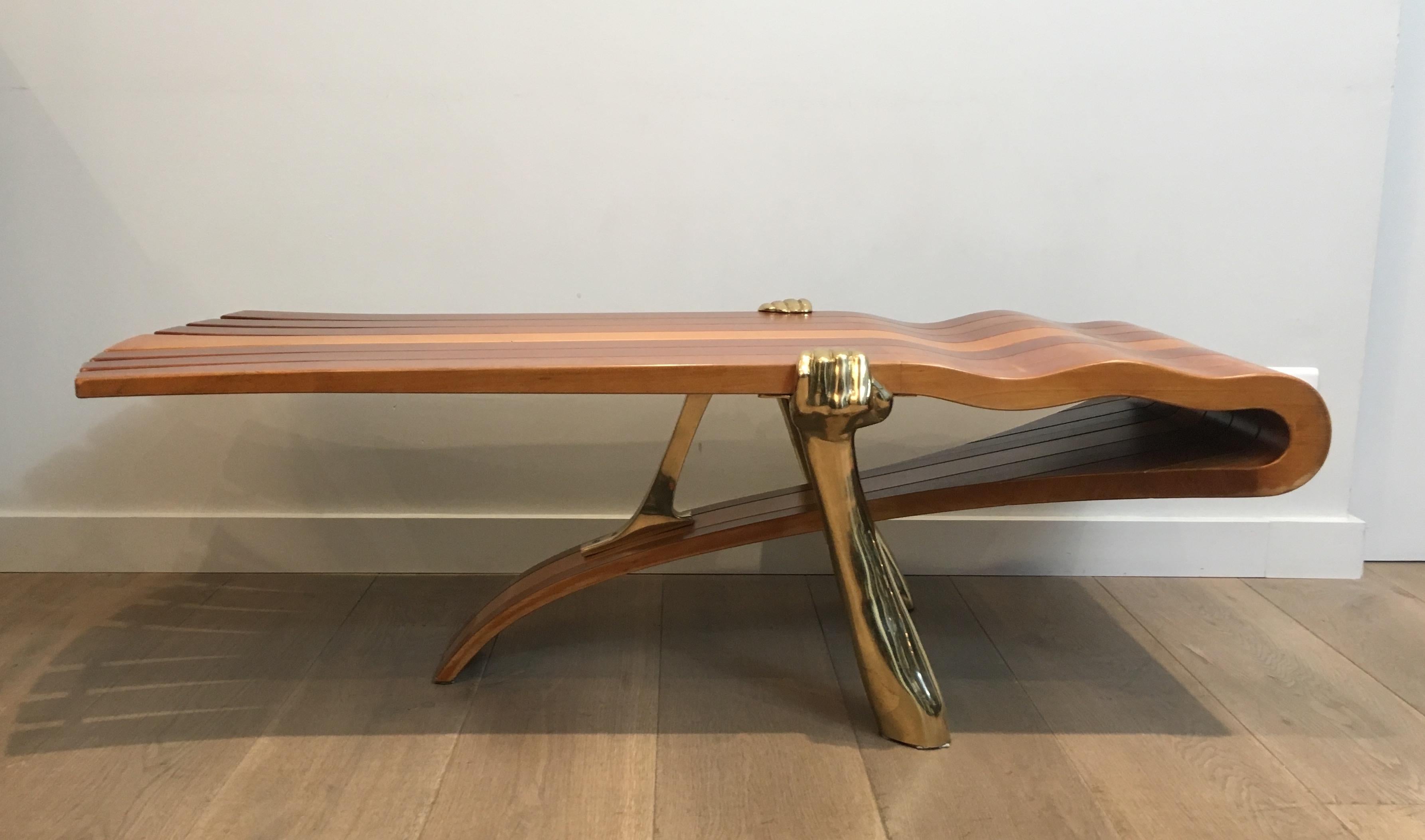 French Unique Coffee Table Made of a Thick Freeform Wood Top Supported by Brass Arms For Sale