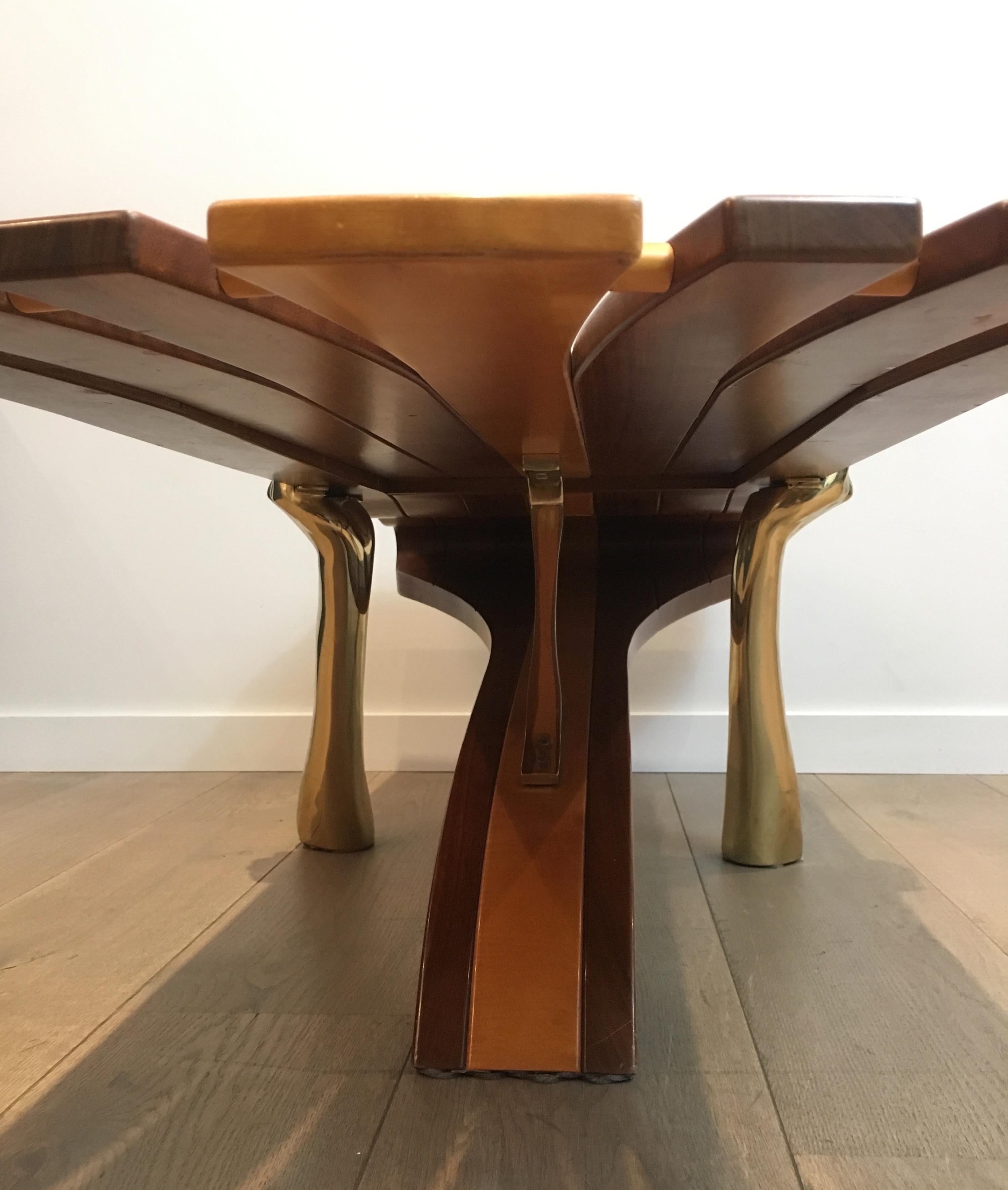 Late 20th Century Unique Coffee Table Made of a Thick Freeform Wood Top Supported by Brass Arms For Sale