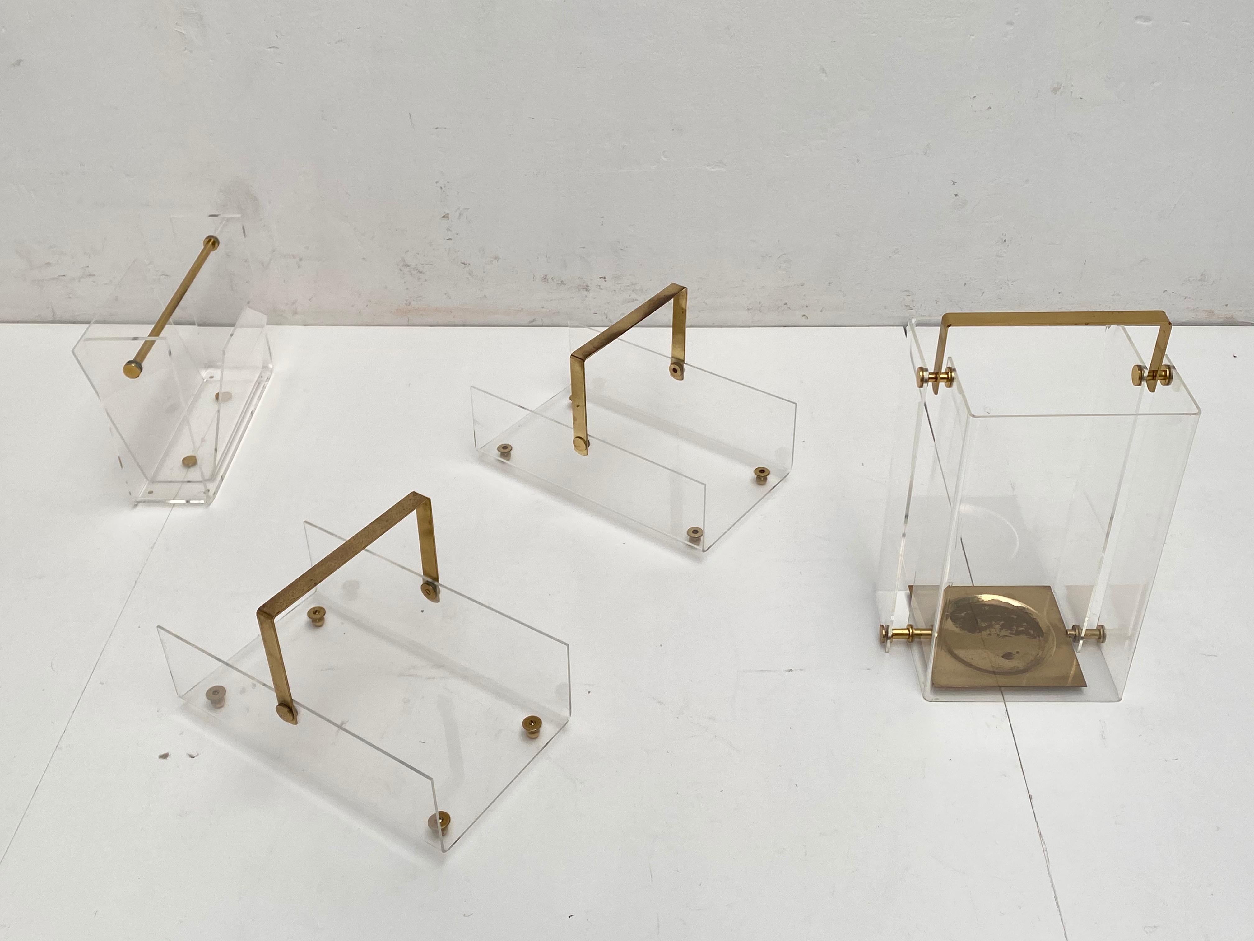 A unique collection of David Lange design in Lucite and brass, France, 1970s

This collection consists of an umbrella holder and 3 magazine rack holders

French high quality finish and production from the 1970s.

        
